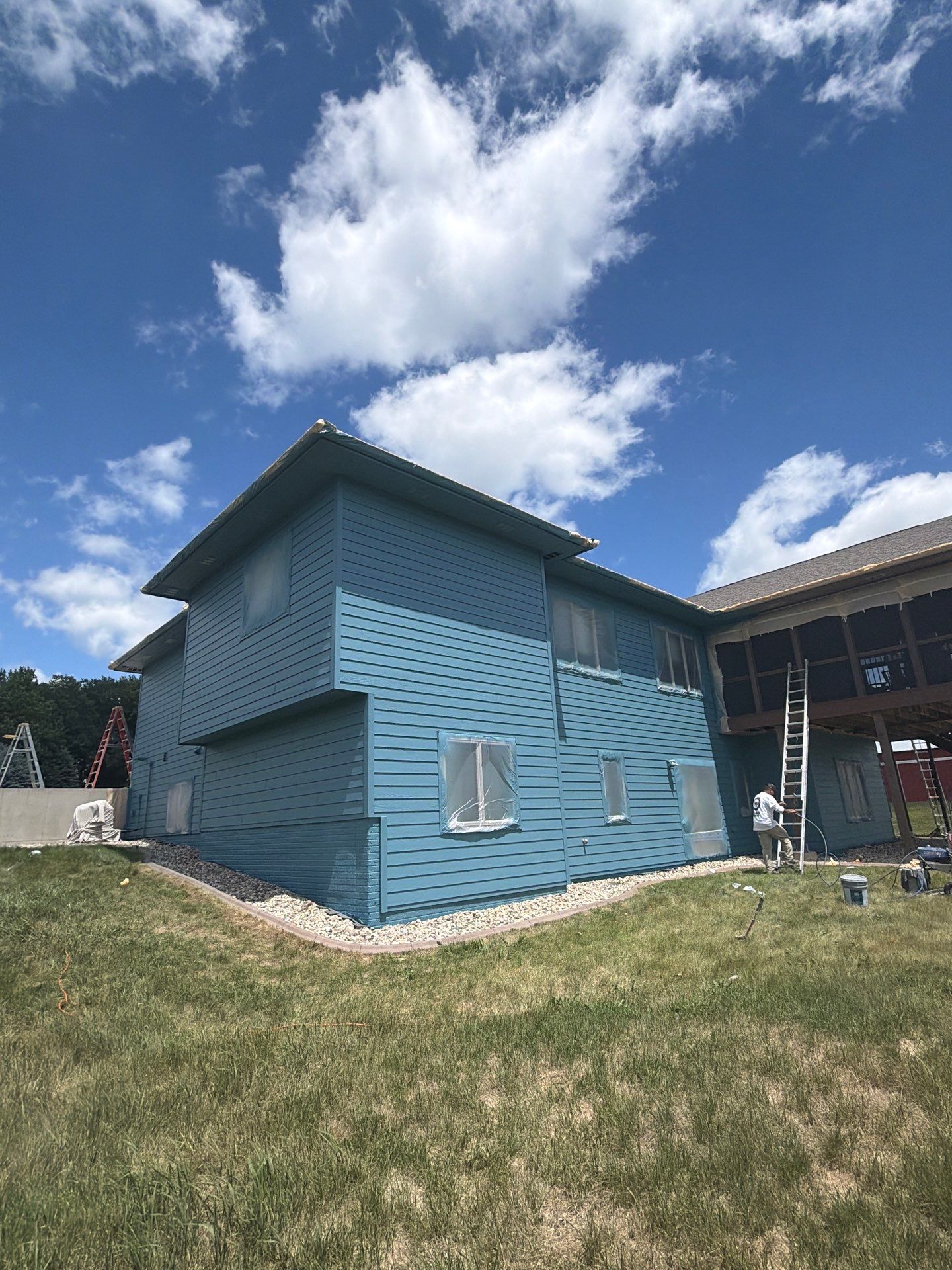 Full Exterior Siding Paint Restoration and Refresh in Garretson