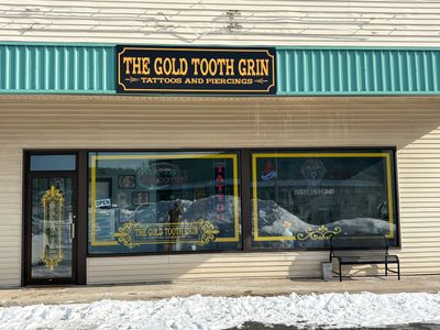 Gold Tooth Grin Tattoo Company Sign Installation in Gansevoort