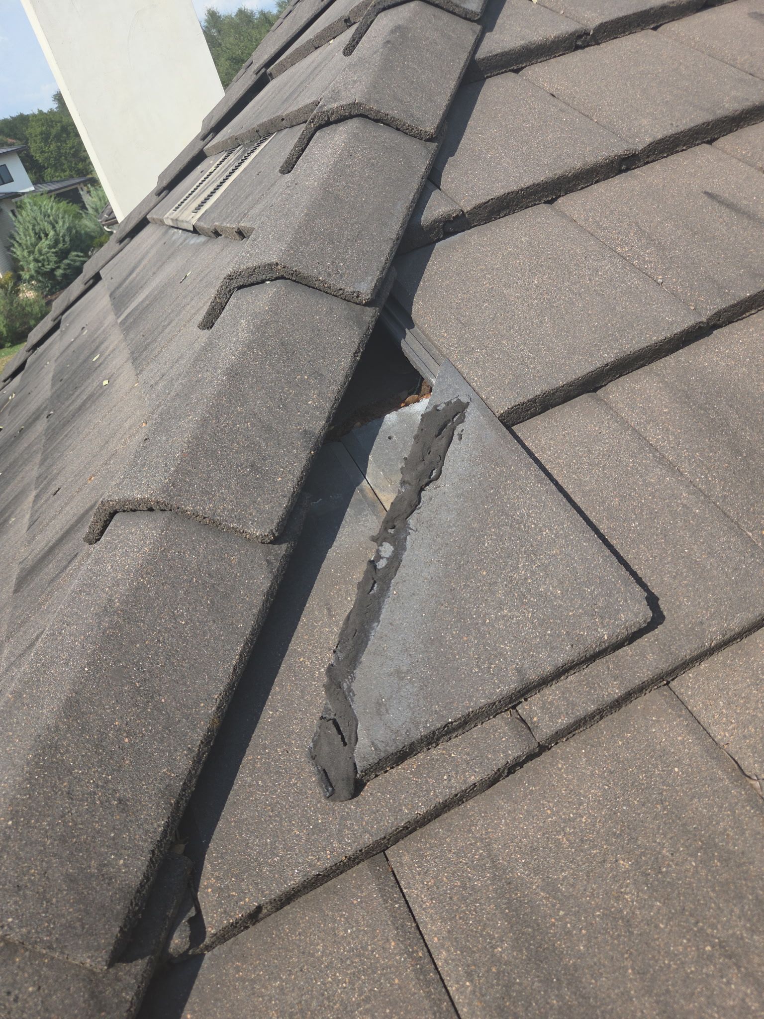 Tile roof and custom chimney cap by REPS Austin Area Roofer