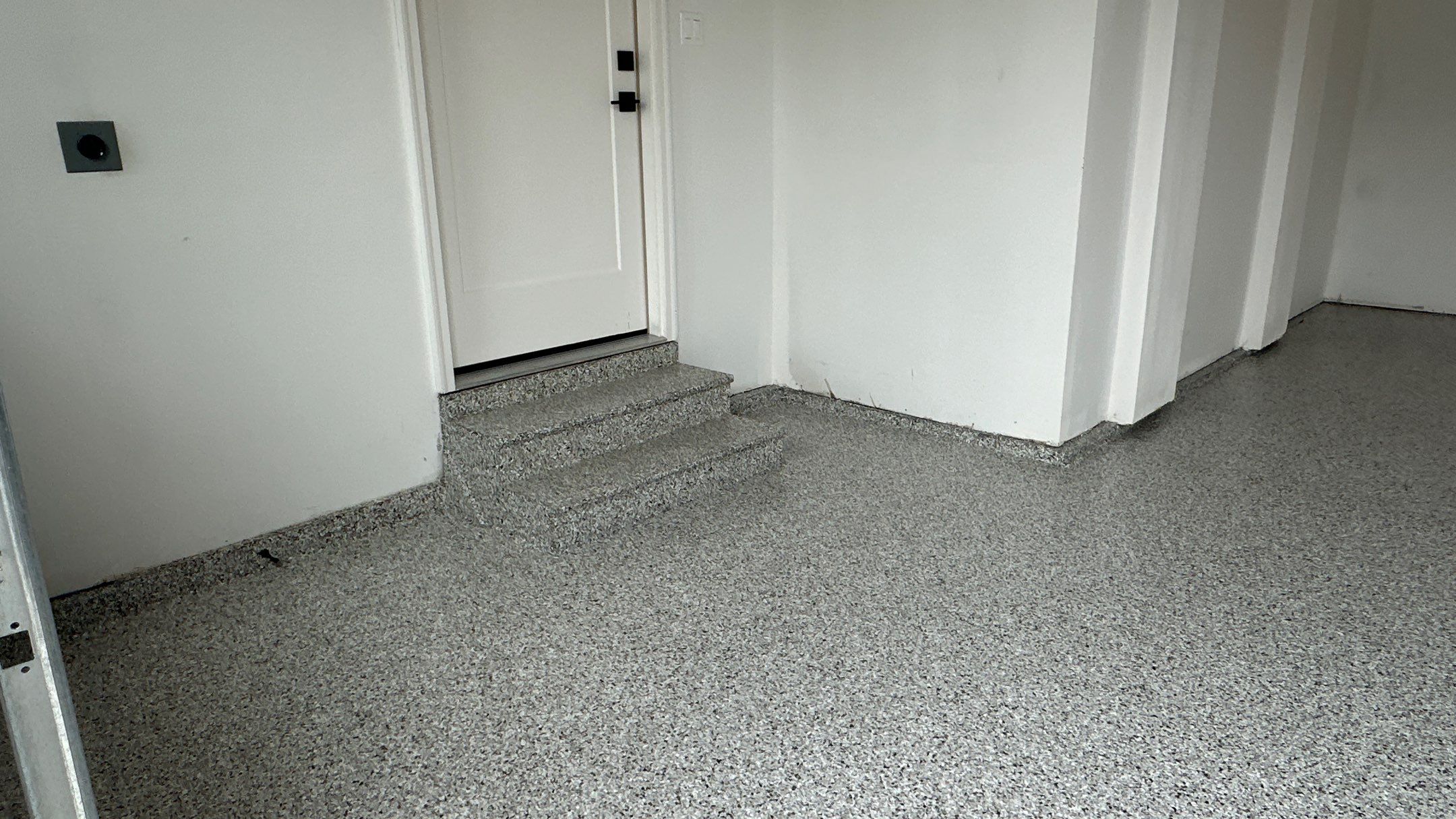 Jon S. transformed his garage with a new floor, slotwall & Cabinets! by Banner Garage