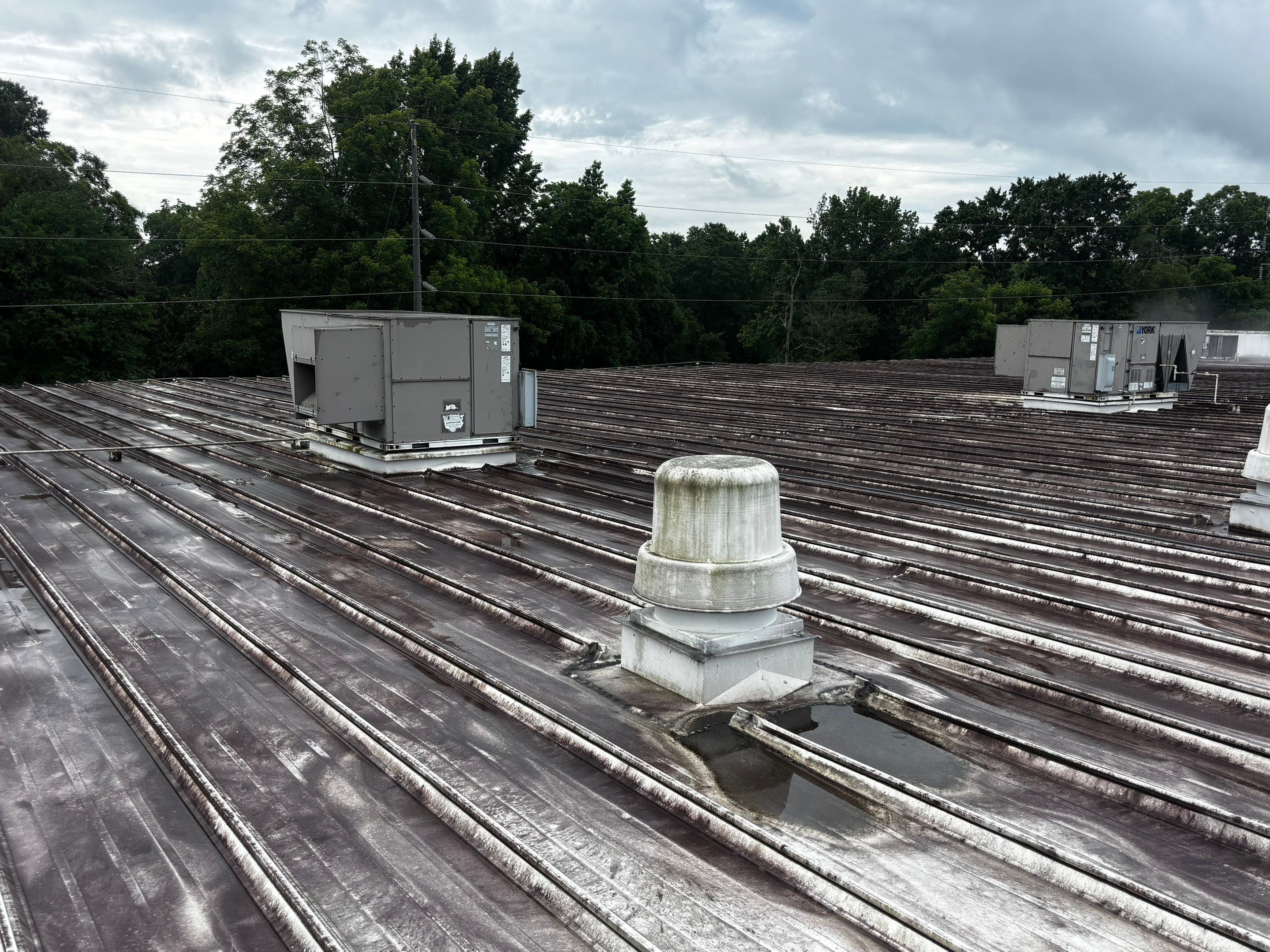 12,180 SQ Ft Commercial Metal Roof Restoration in Clarkston by Southern Roof Solutions
