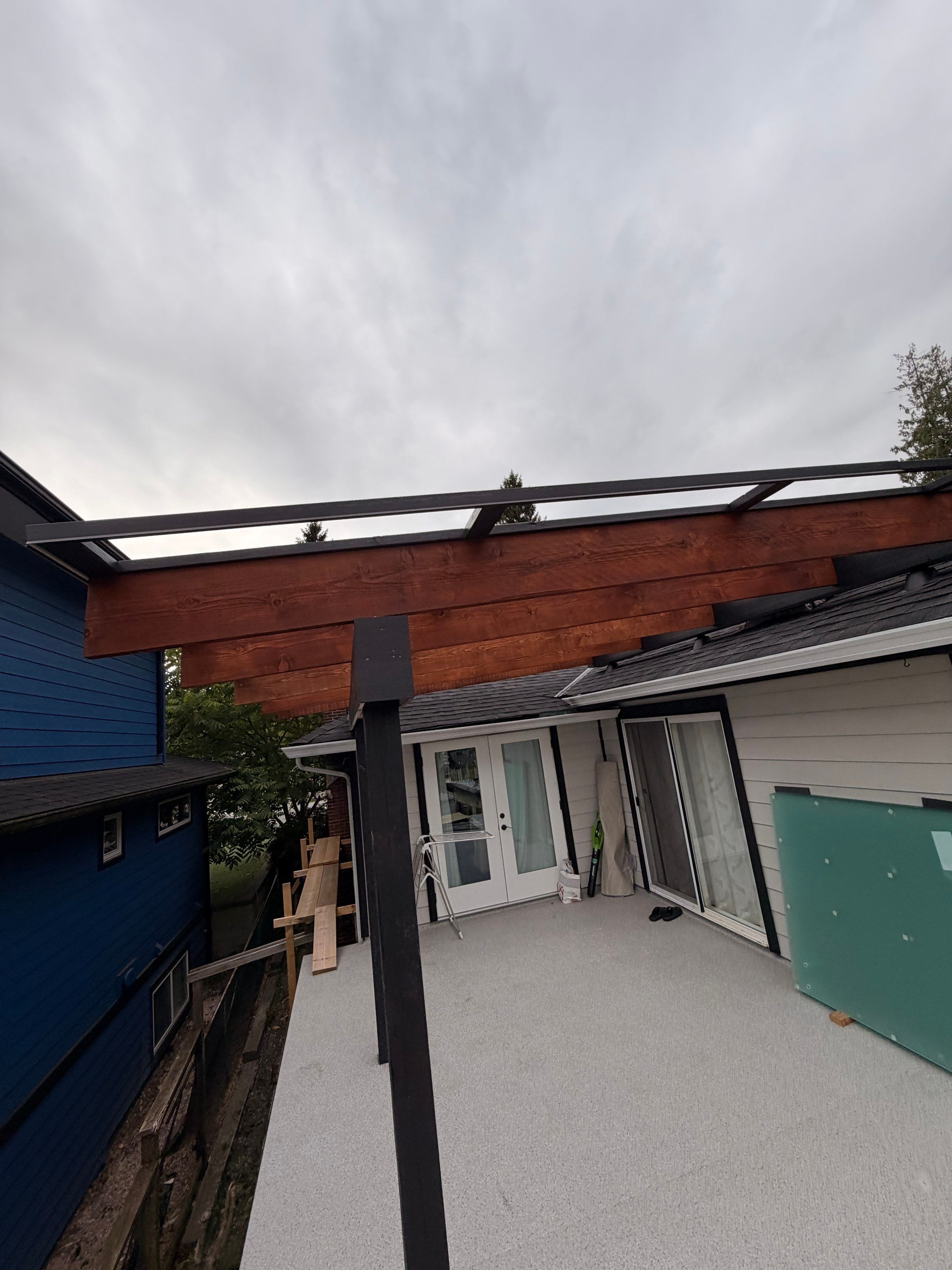 New Composite Deck with glass railing in North Vancouver by YVR Construction Group