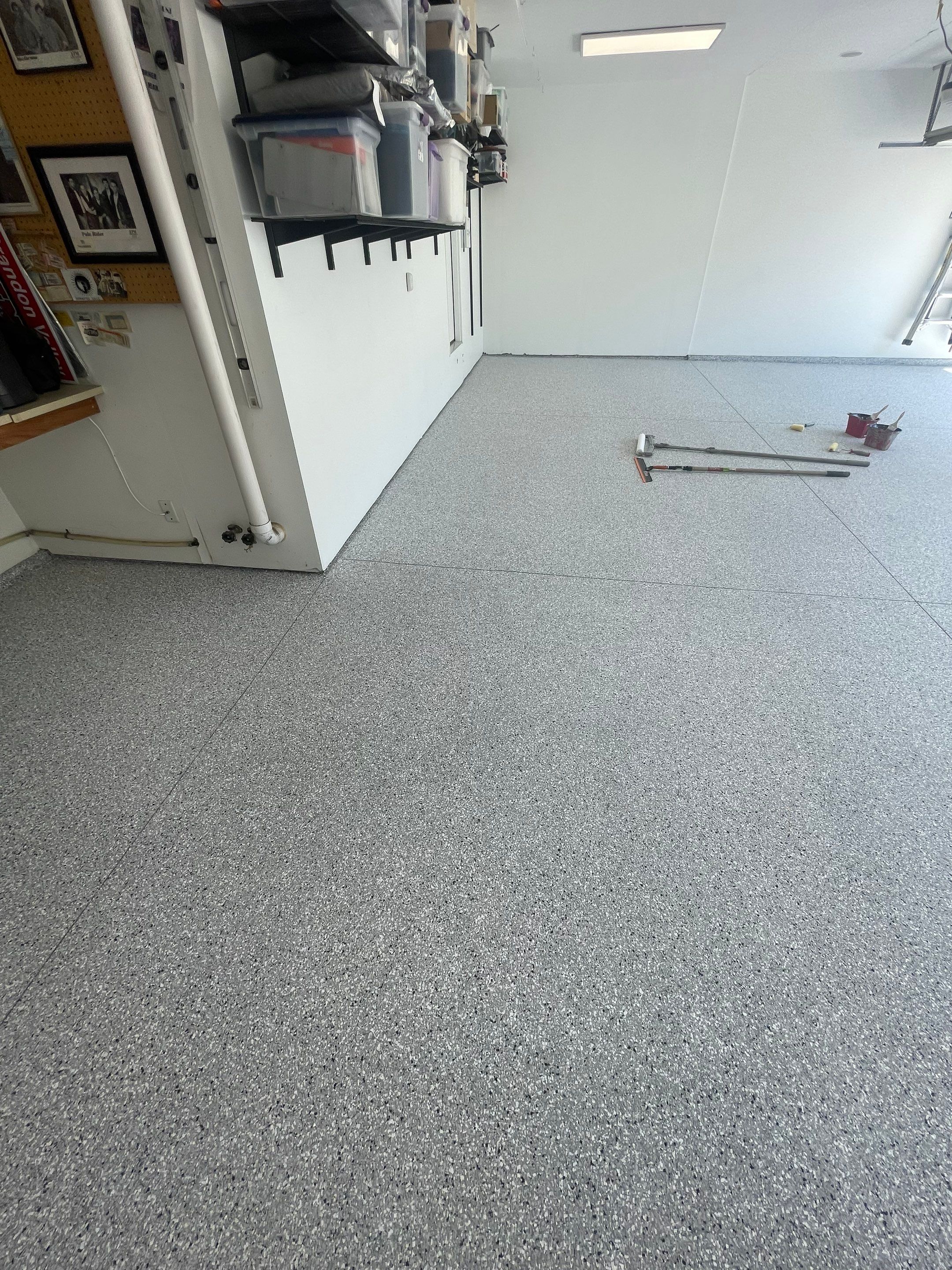 Feather Grey Garage Floor Coating Installation in Sioux Falls by Select Painting, Coatings & Garage Cabinets