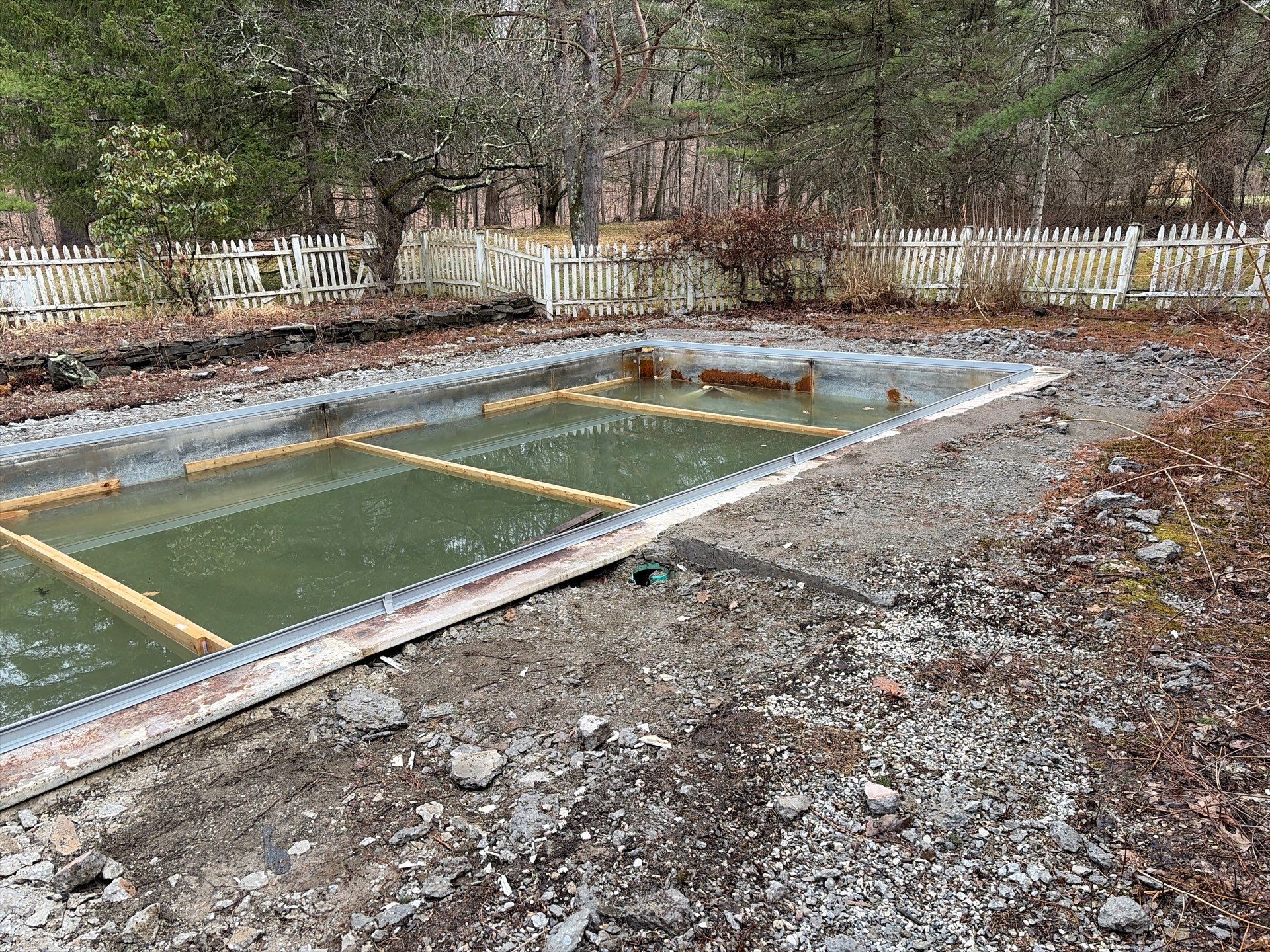 In-Ground Swimming Pool Renovation and Concrete Decking in Old Chatham by Cypress Pools and Spas