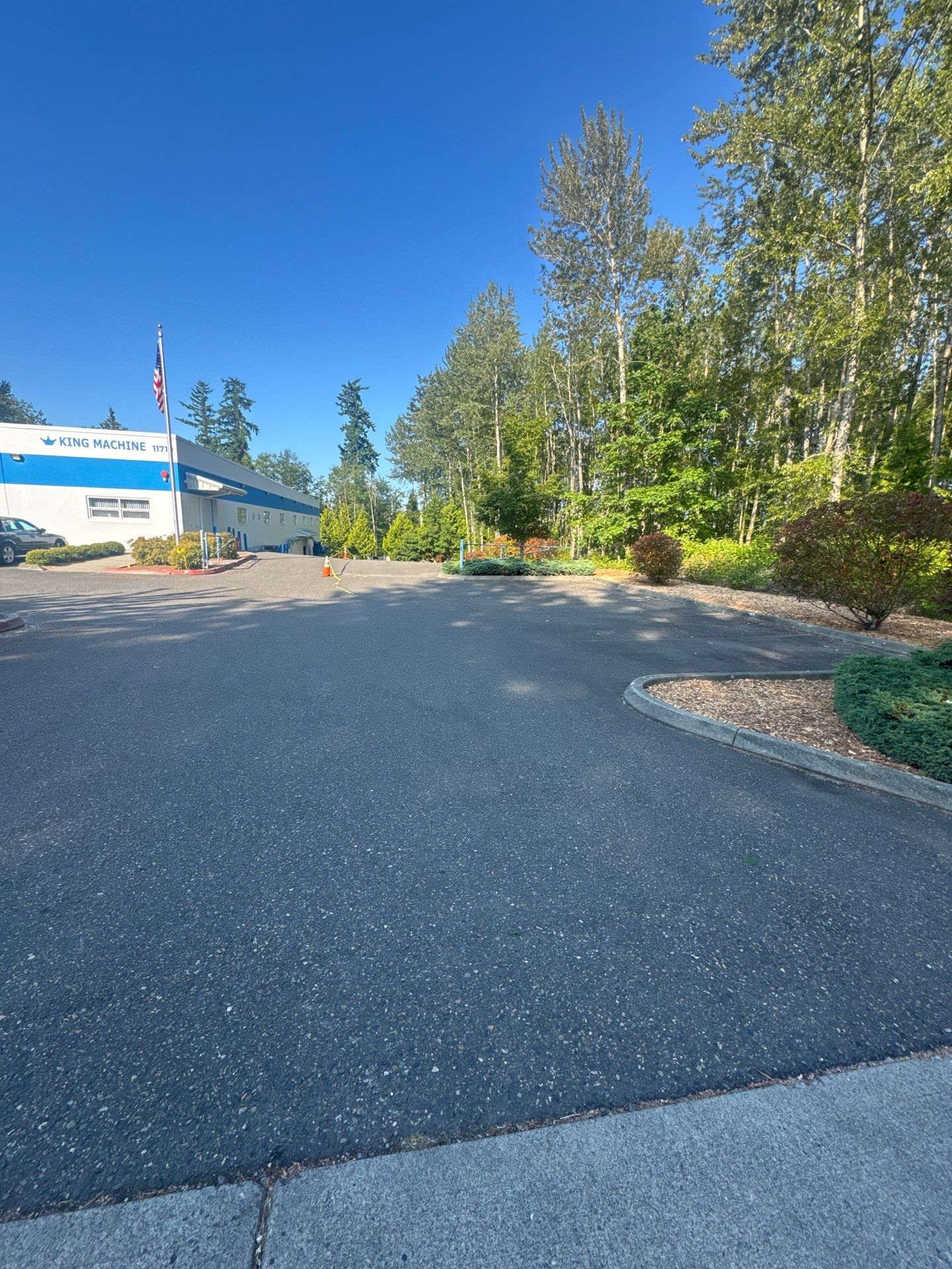 King Machine Business Parking Lot Sealcoat Overlay | Mukilteo by Jireh Asphalt & Concrete Inc 