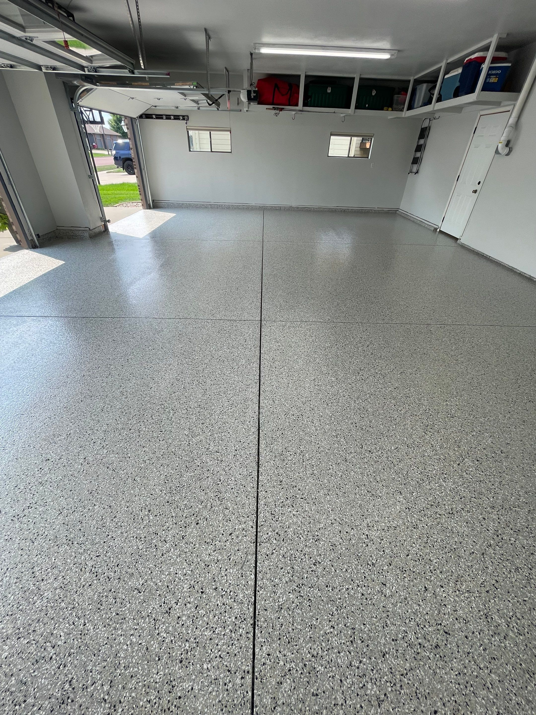 Multi-Car Garage Floor Coating and Crack Repair in Tea by Select Painting, Coatings & Garage Cabinets