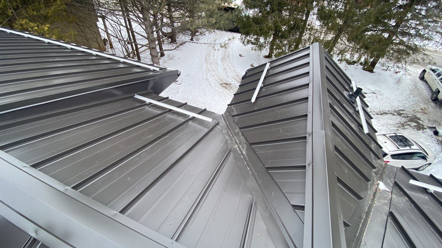 Residential Roofing Installation using 16" Standing Seam Panels by Jay Carter Roofing & Sheet Metal