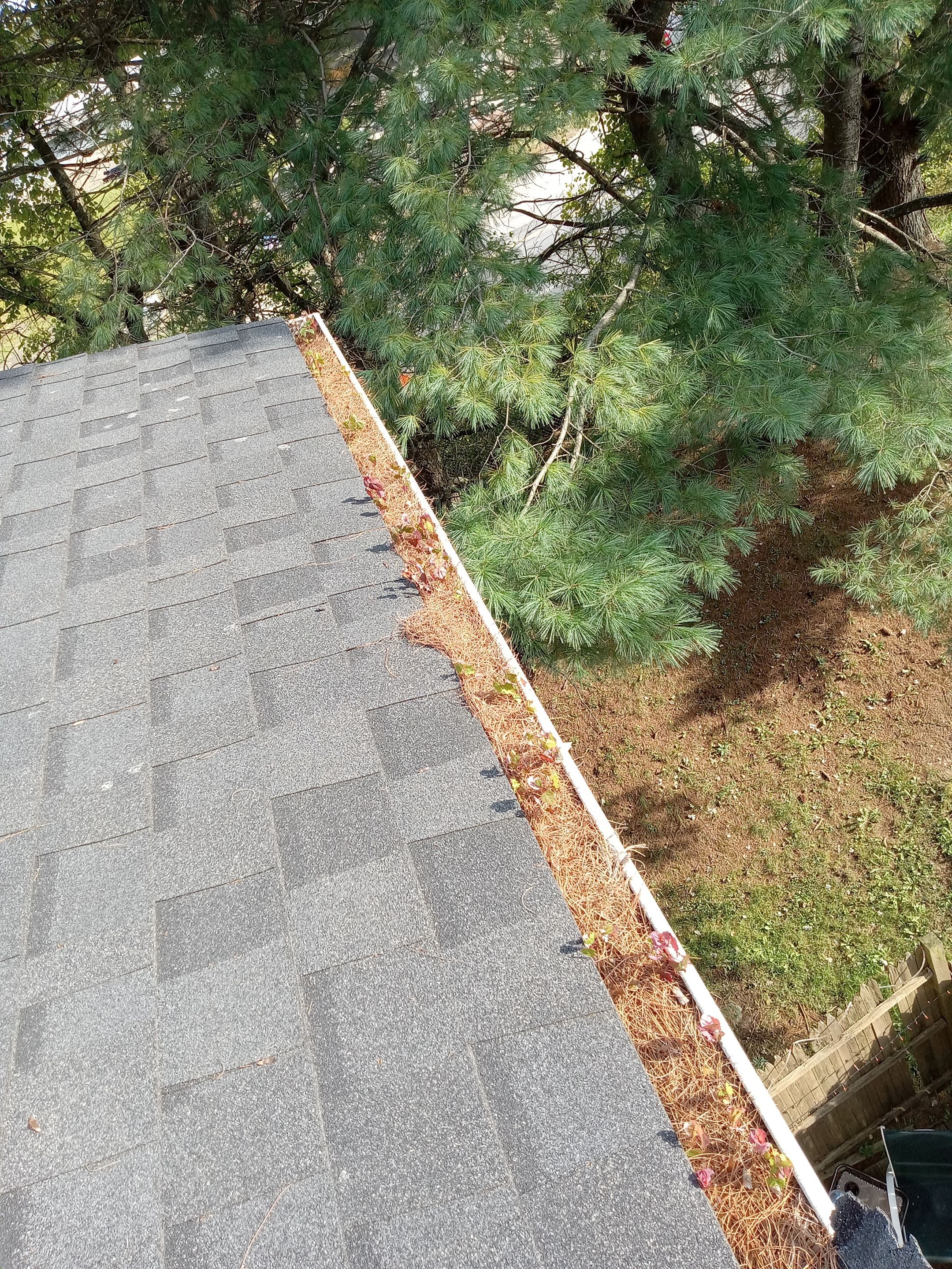 Commercial gutter cleaning Burlington before photo with filled gutters