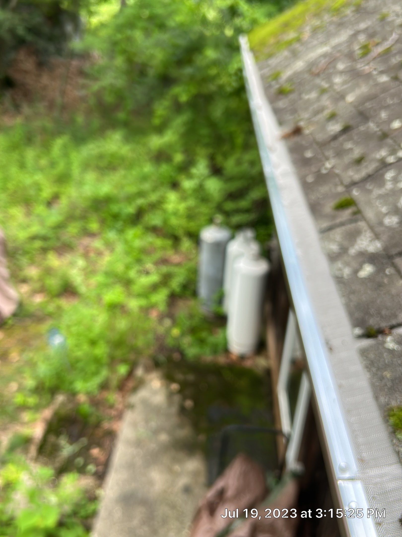 Gutter Installation using 5k Brown Gutters by A Plus Exterior