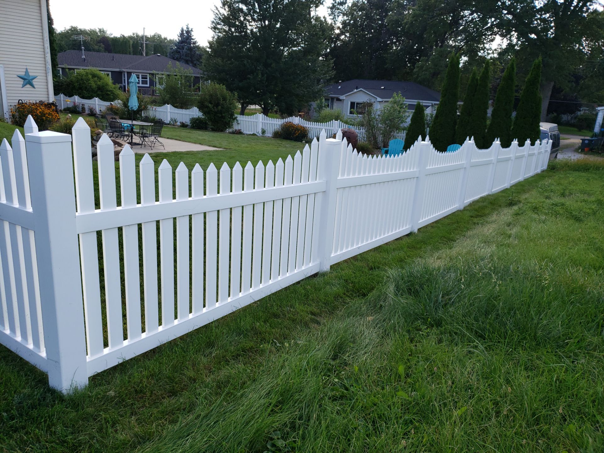 White Vinyl Spaced Picket Fence Installation in Waterloo by Perfect Picket Fence and Stain