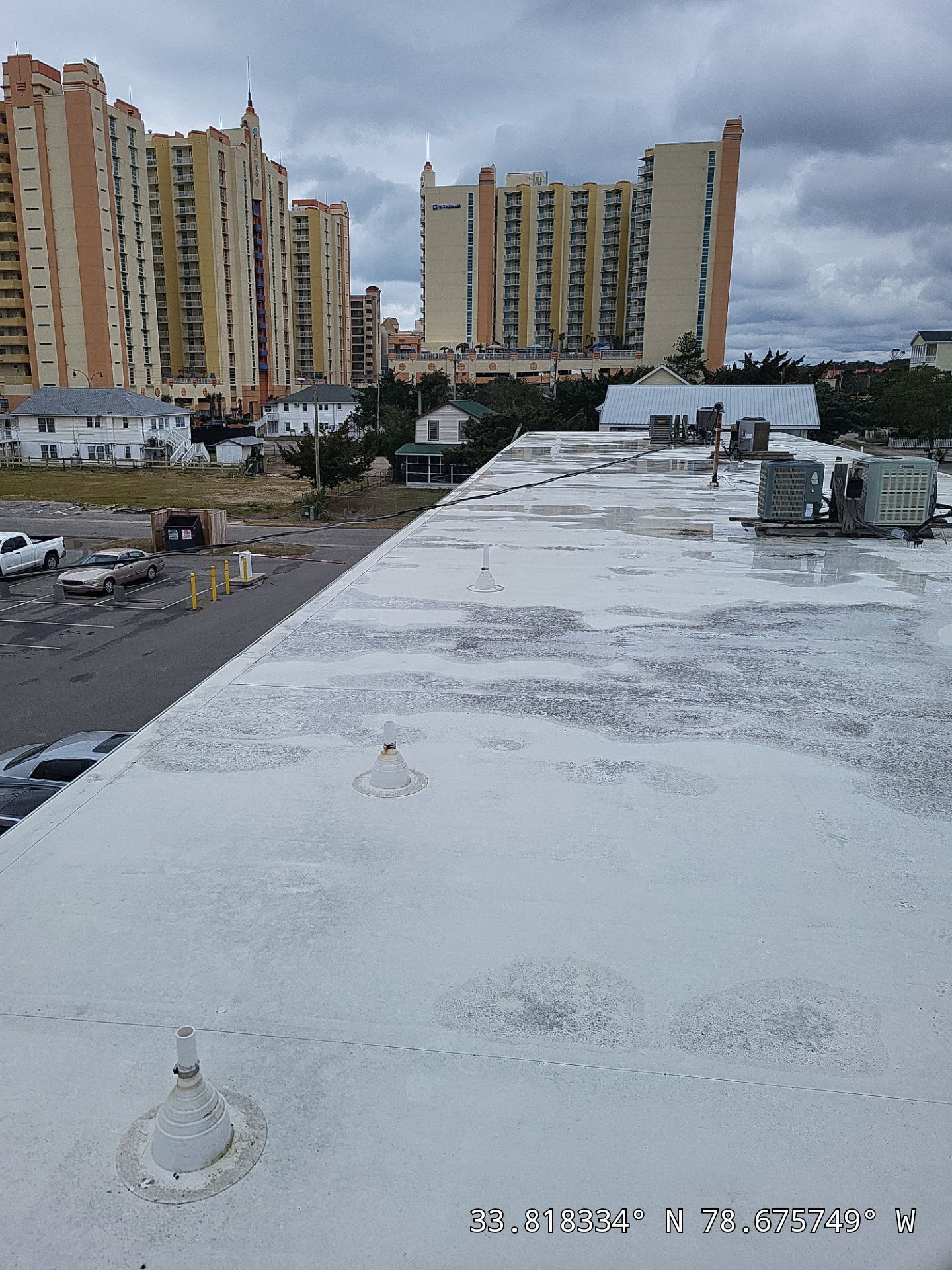 Commercial Building Roof Coating using 924 Eterna-Sil Premium Silicone Roof Coating by RGR Construction and Roofing, LLC