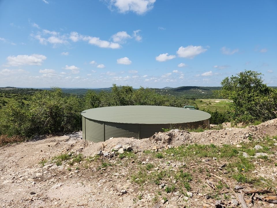 Residential Rainwater Collection System - Pioneer 40K gallon water tank in Mangrove Green by Hill Country Rain Water
