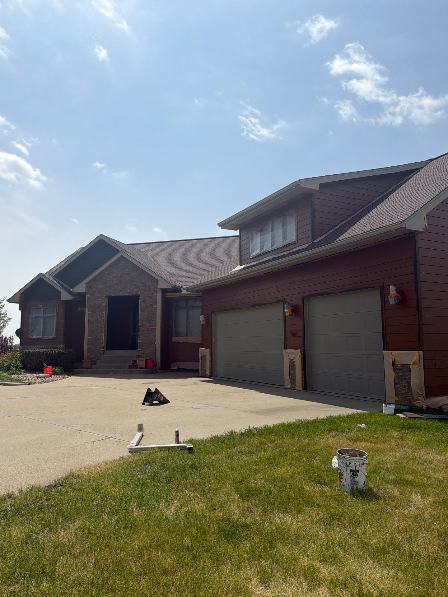 Residential Exterior Painting and Siding Restoration in Crooks by Select Painting, Coatings & Garage Cabinets