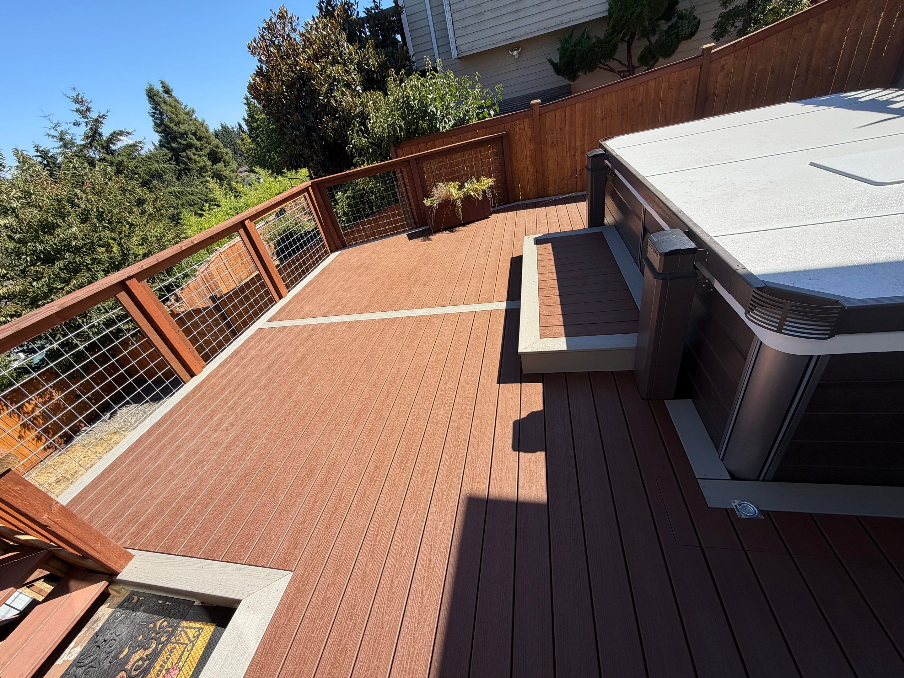 Tacoma Custom Composite Deck and Hot Tub Surround with Retaining Wall by Emerald City Energy 