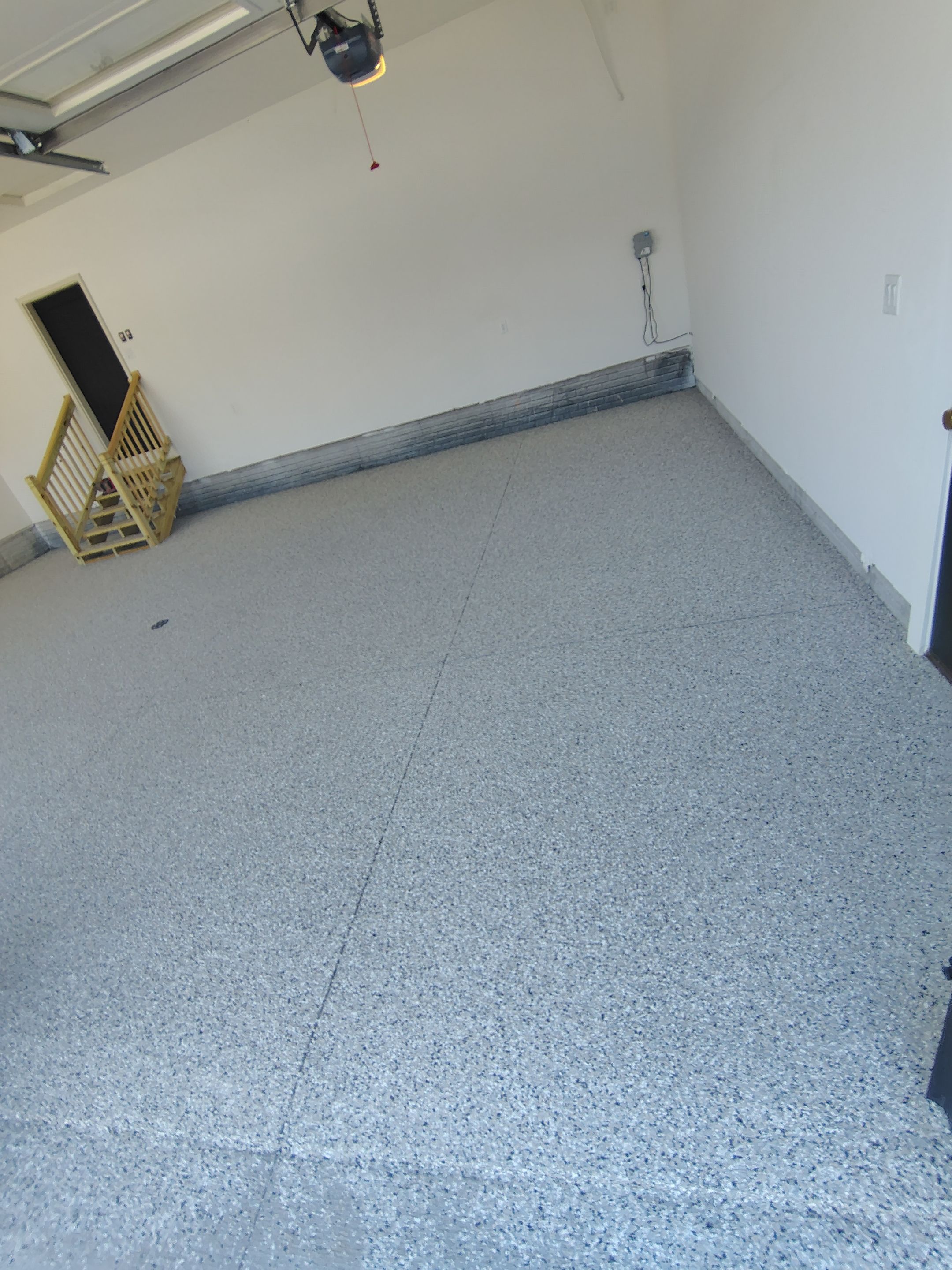 Cabin Fever Decorative Flake Garage Floor Coating in Sioux Falls by Select Painting, Coatings & Garage Cabinets