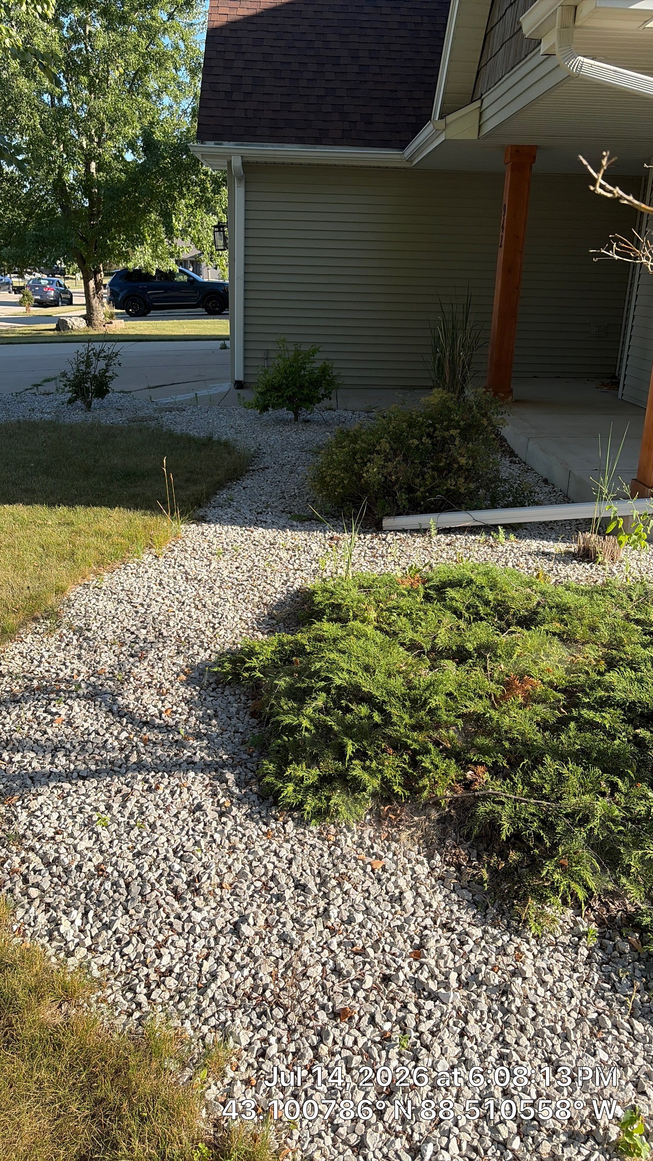 Decorative Stone and River Rock Landscaping for Oconomowoc Residence by CompanyCam Sales Demo