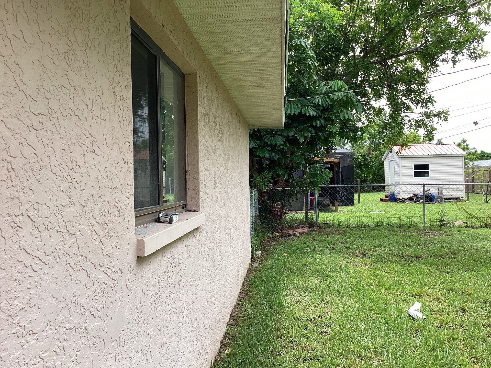 Replace gutter using White Down Spouts in Cape Coral FL by Gutter Professors