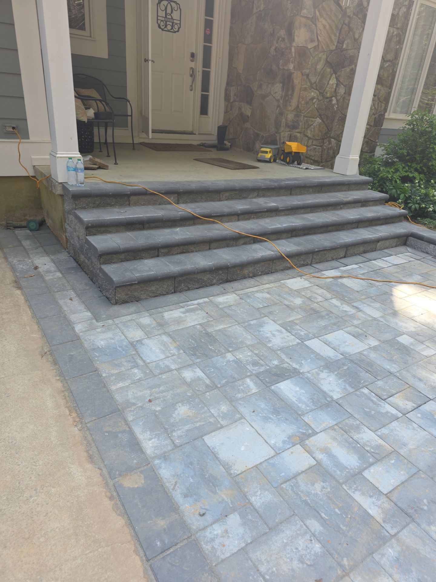 Pittsboro Outdoor Living Transformation – Retaining Wall, Paver Patio & Elevated Deck by Elite Remodeling and Design LLC