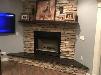 Wood Fireplace + stone + mantel