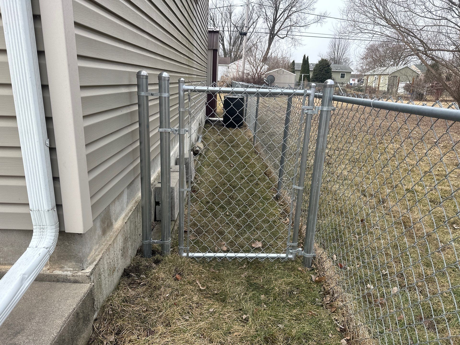 Galvanized Chain Link Fence and Vinyl Gate Installation in Washburn by Perfect Picket Fence and Stain