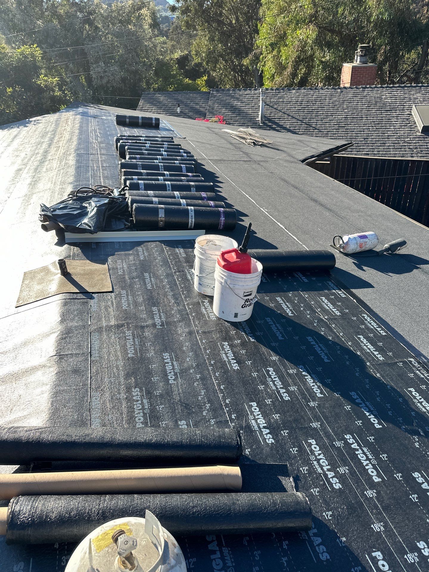 Residential Roofing Installation using Polyfresko® G Highly Reflective Modified Bitumen Cap Sheet by Hull Brothers Roofing