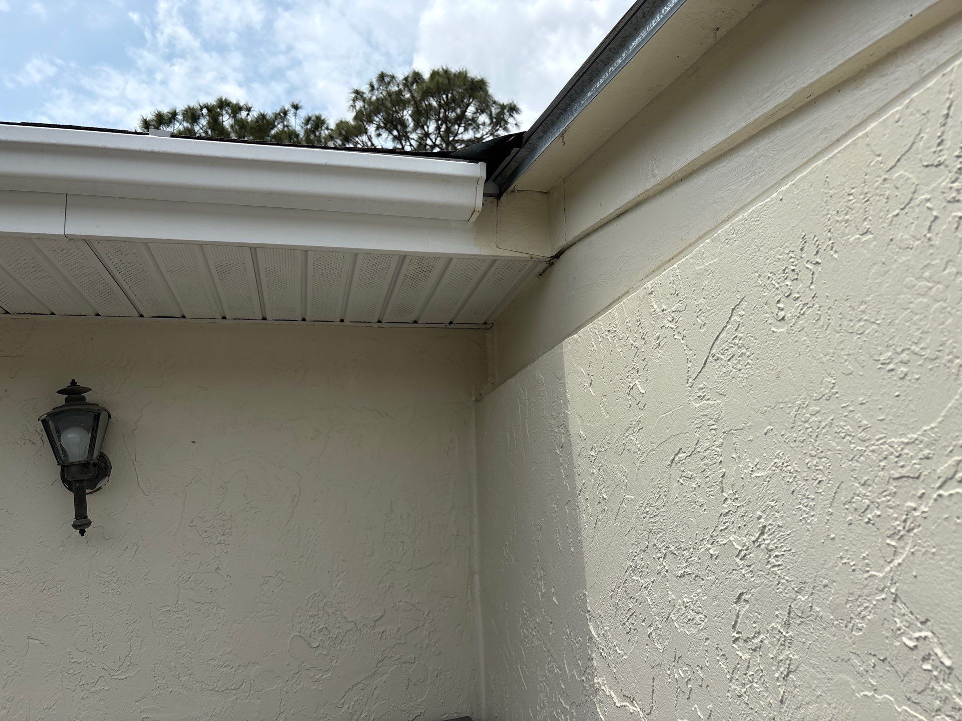 Gutter Project with White 6-K Seamless Gutters Installation and Downspouts in Sarasota FL by Gutter Professors