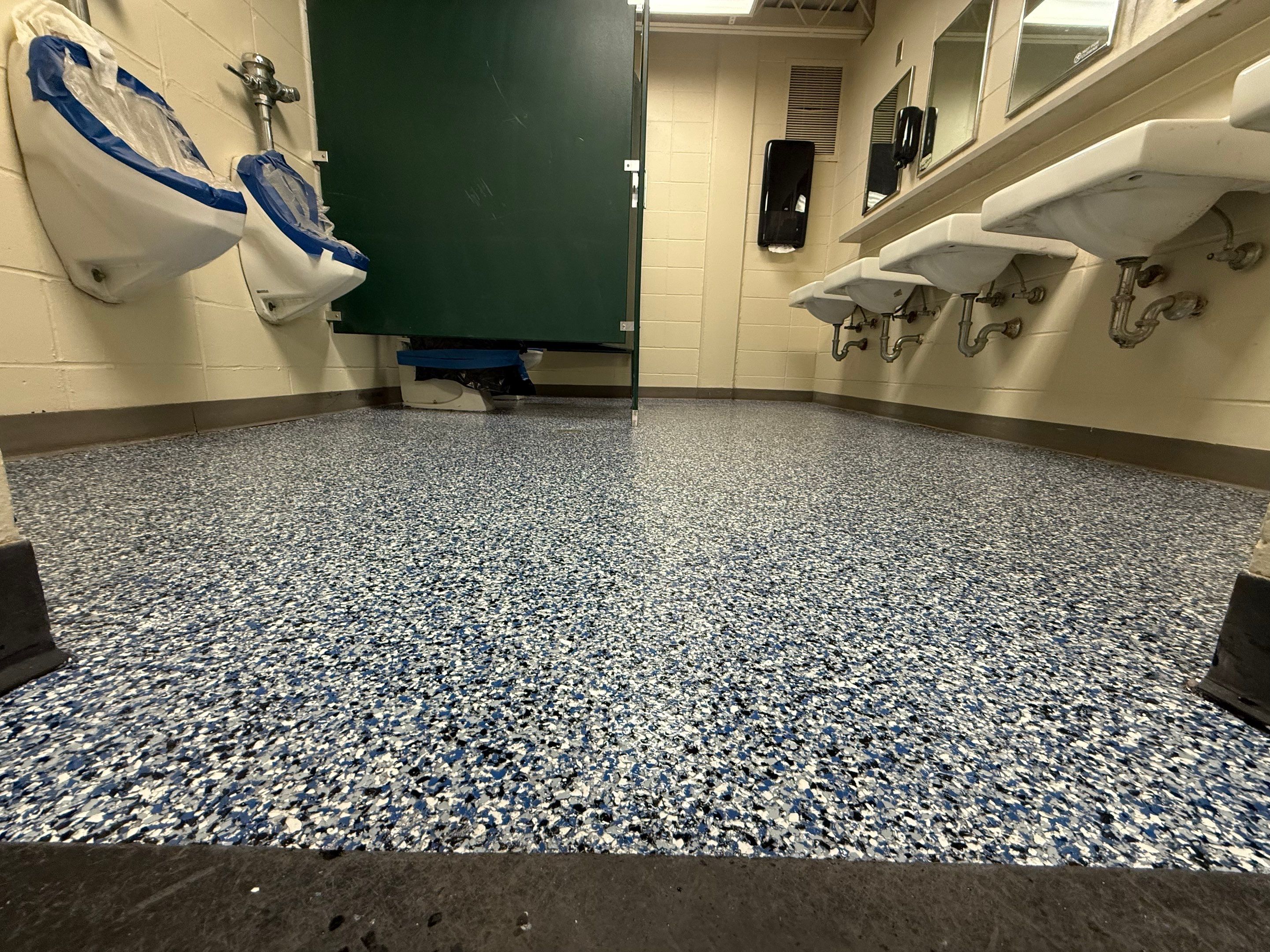 Seamless Epoxy Floor Coating at the Sioux Falls Canaries Facility by Select Painting, Coatings & Garage Cabinets