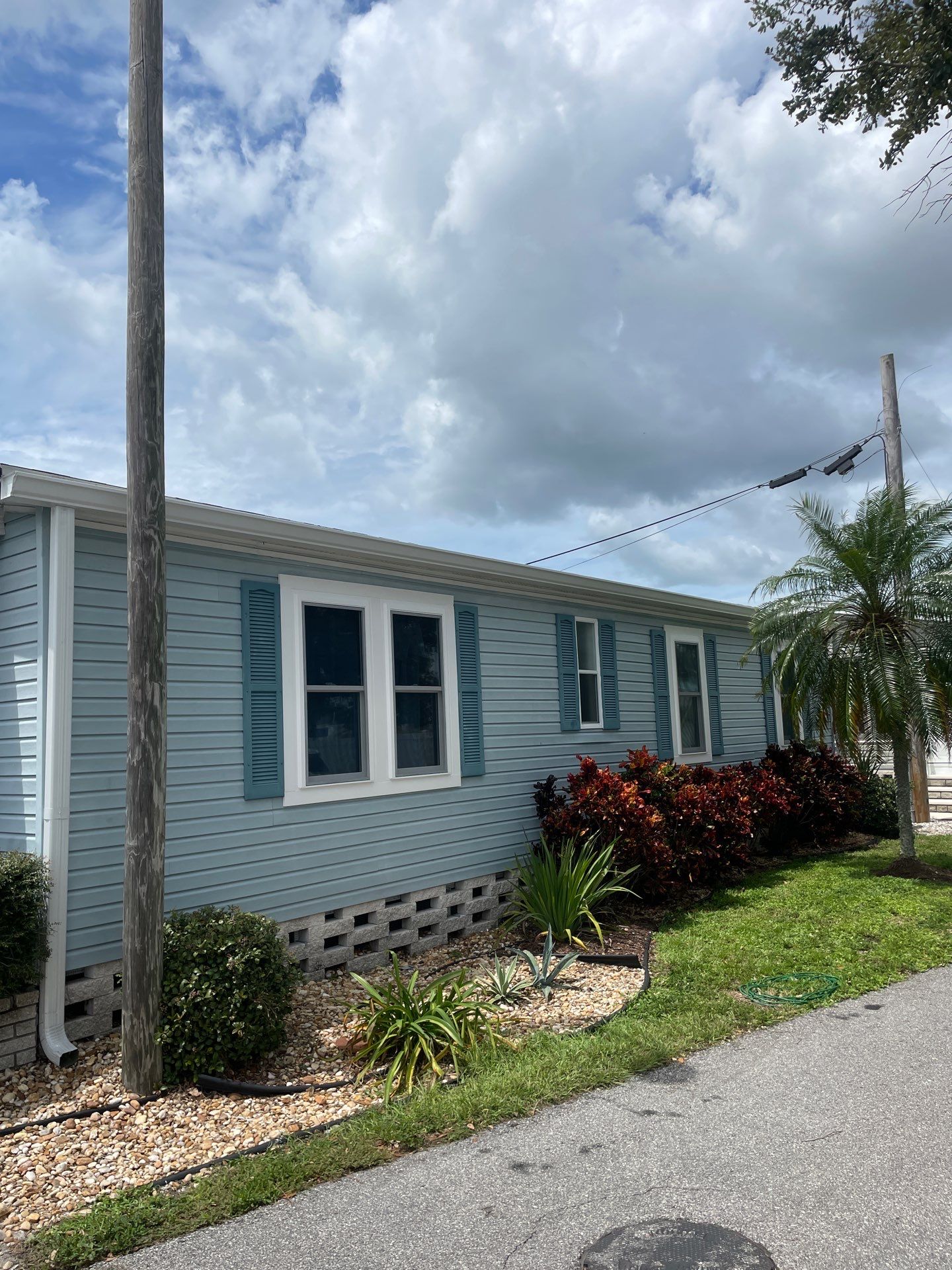 6-inch white seamless gutters in Sarasota FL by Gutter Professors
