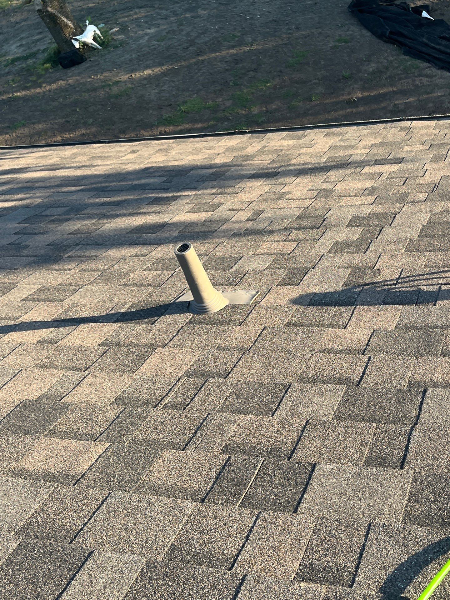 IKO Driftshake-Light Cream brick house by Tejas Roofworks + Restoration