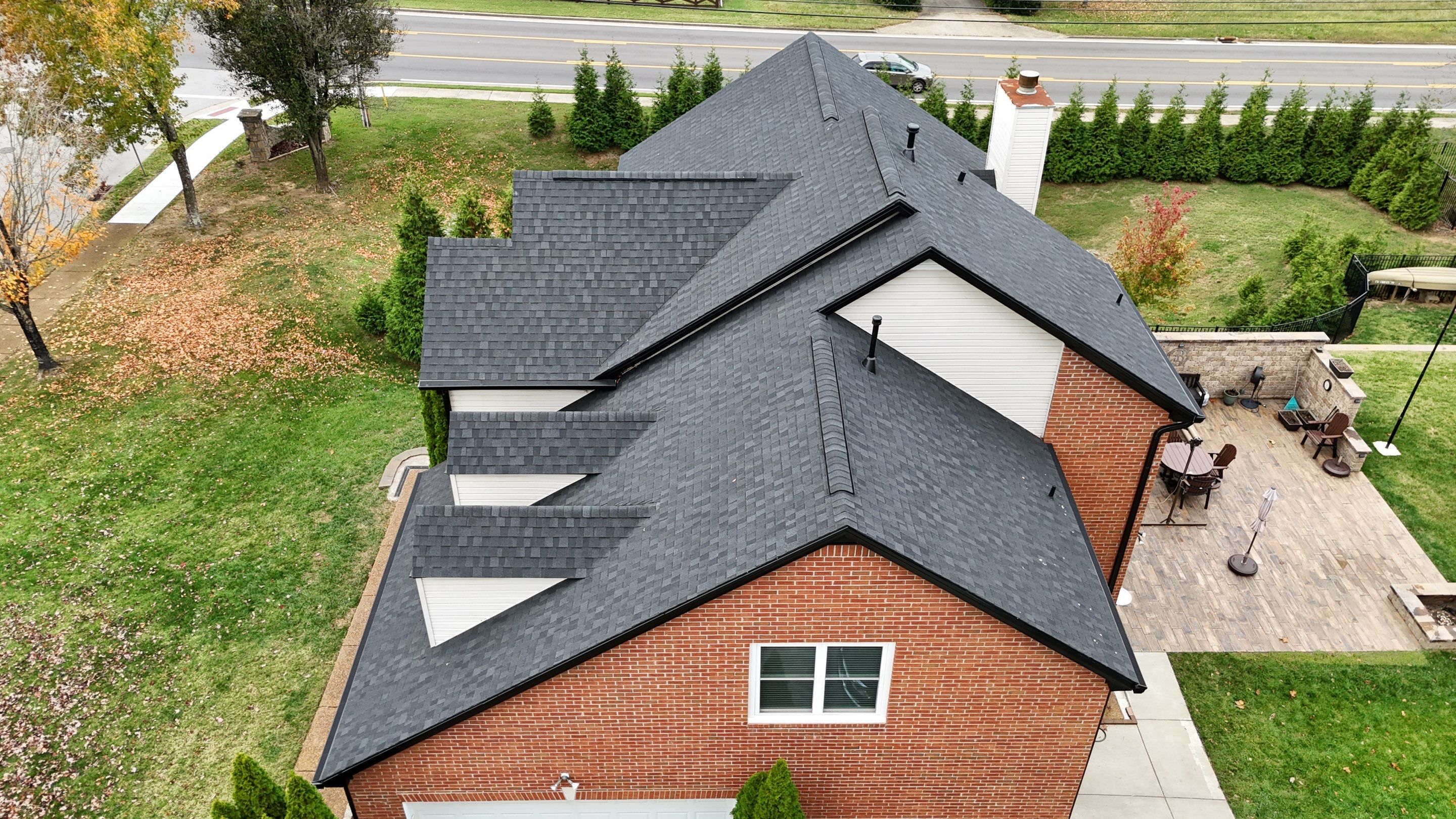 Charcoal Black Re-Roof & Gutters by Royal House LLC