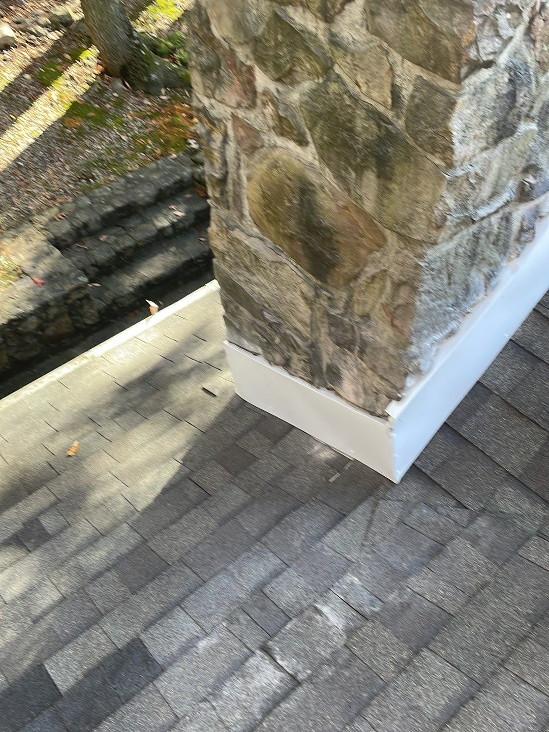 Insurance repair and chimney saddle installation. by Teflon Roofing