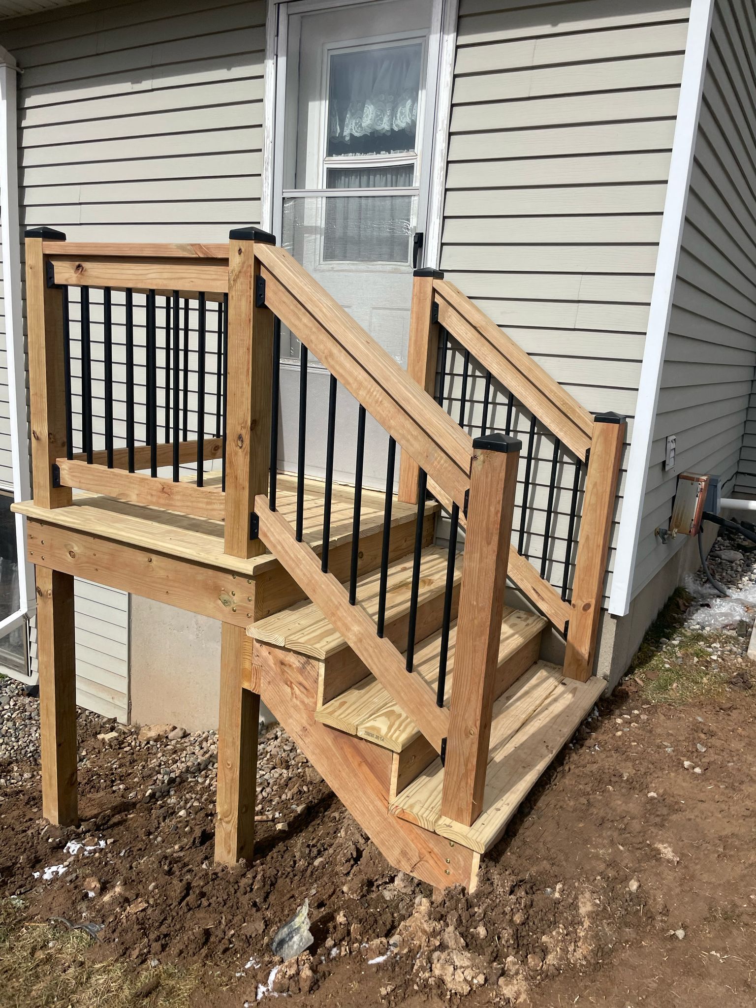 Deck Installation using Treated Lumber by Avalon Roofing and Exteriors