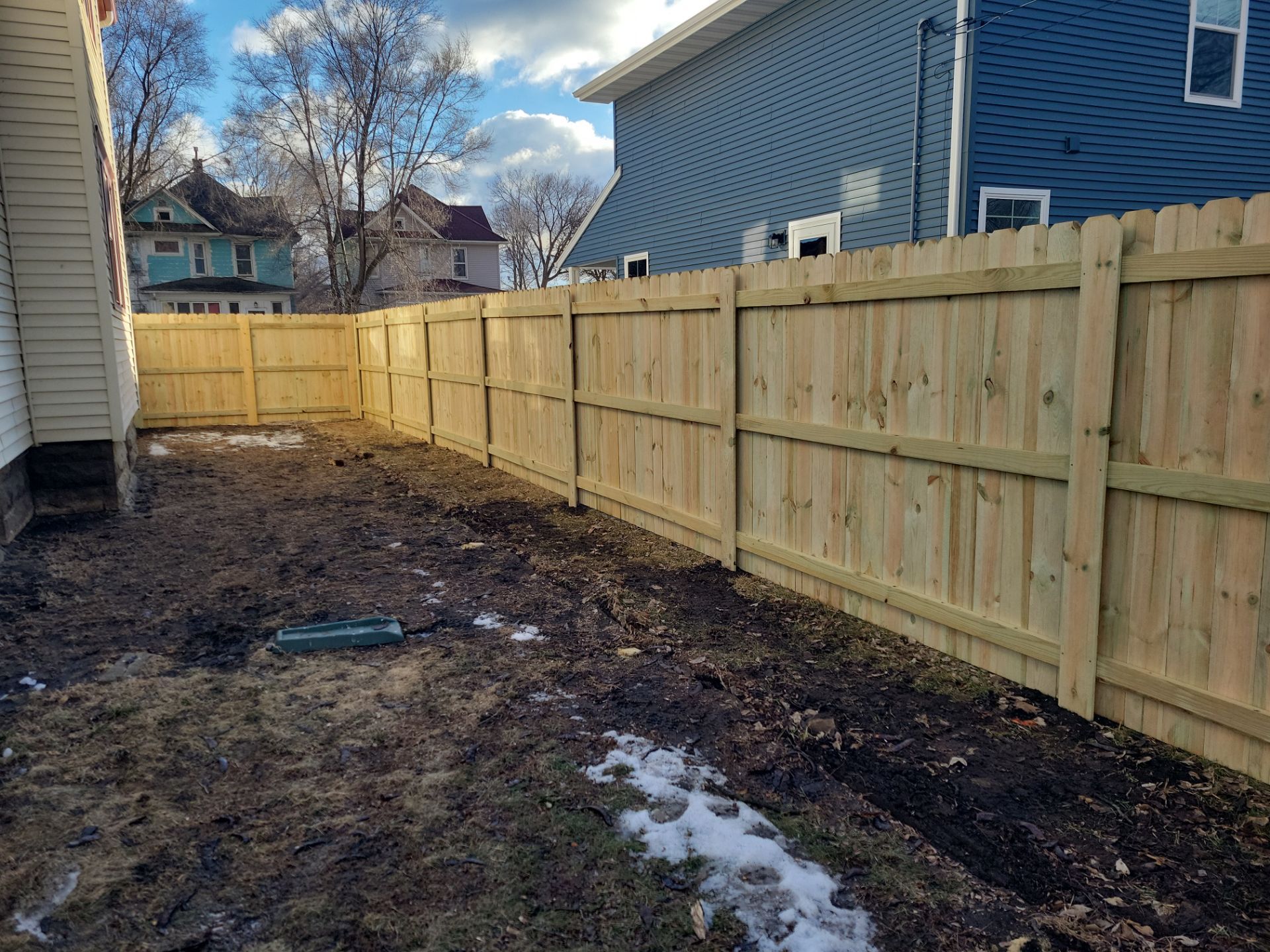 Pressure-Treated Wood Privacy Fence and Double Gate Installation in Waterloo by Perfect Picket Fence and Stain