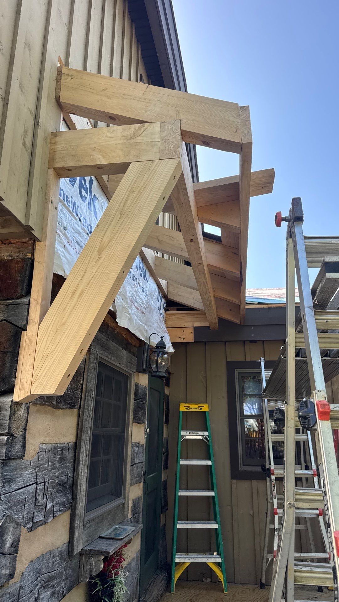 Custom Composite Deck with Stone Fireplace and Modern Cable Railing by Walnut Hollow Decks & Outdoor Living