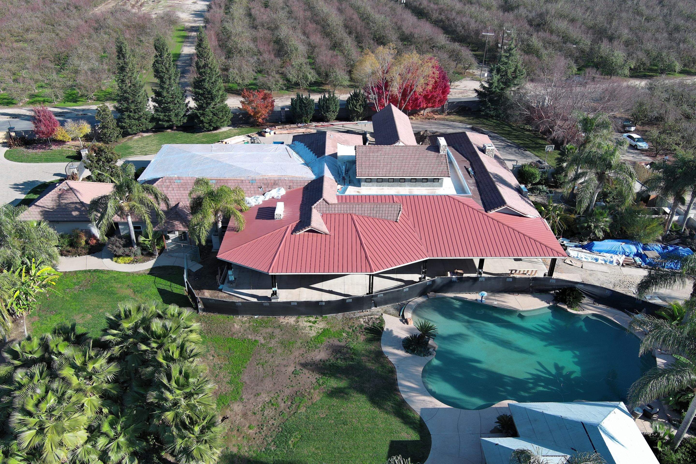 Tile, Metal, and TPO roofing project (new construction) by Straight Edge Roofing Inc