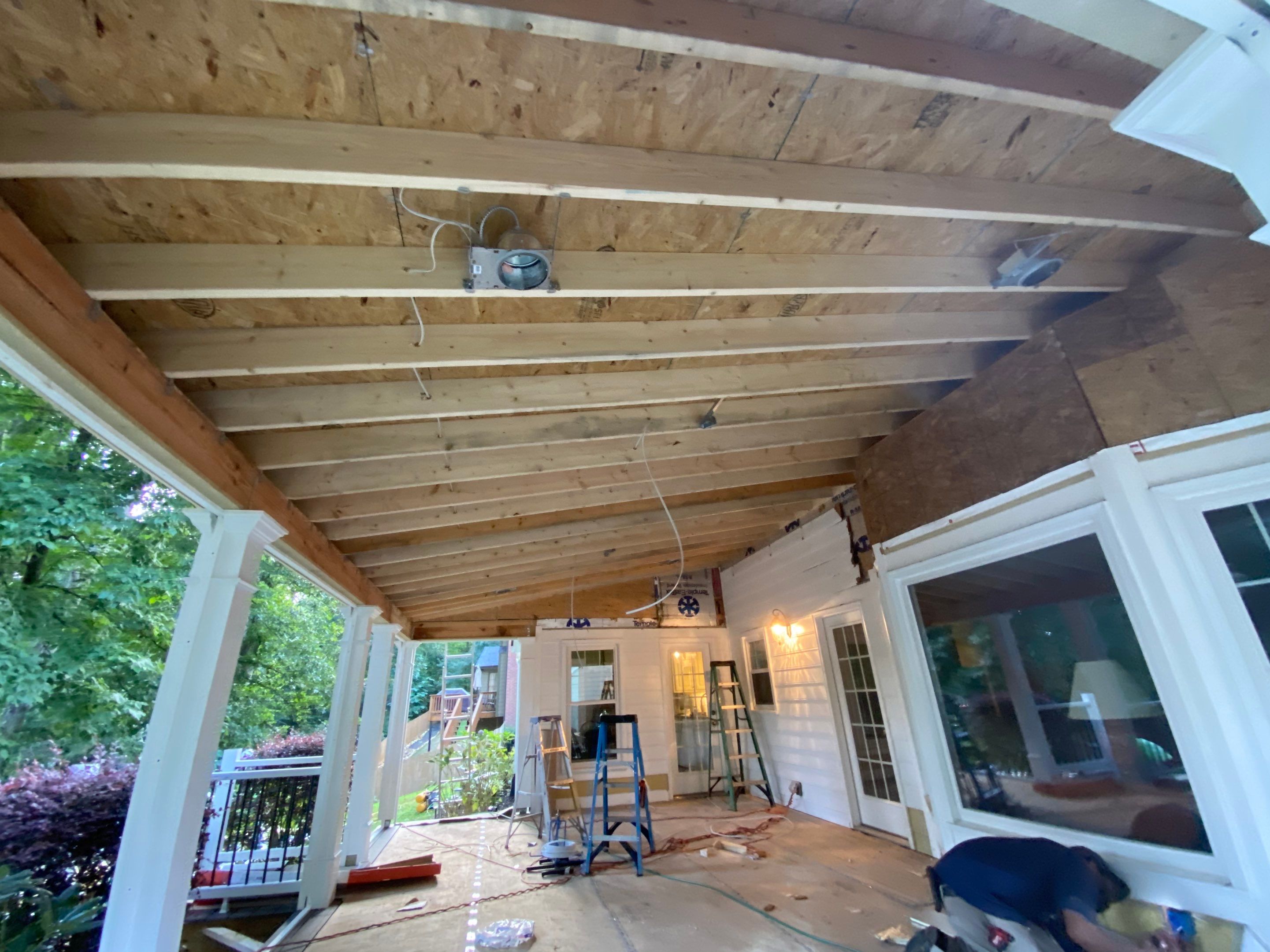 Custom Screened Porch with Beadboard Ceiling and Composite Decking by Swift Home Renovations