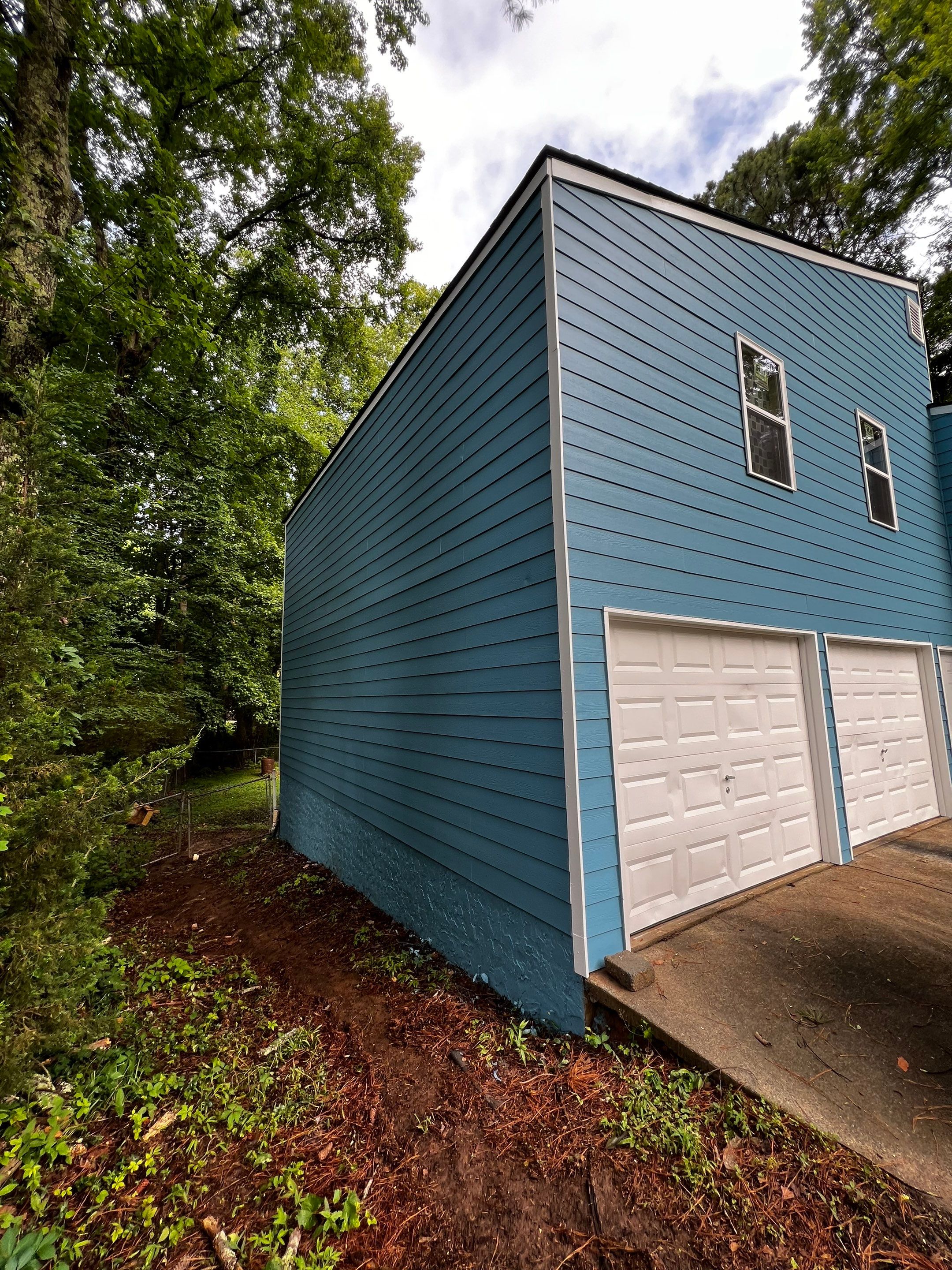 Elevated Wood Deck and Blue Lap Siding Installation in Kennesaw by Swift Home Renovations