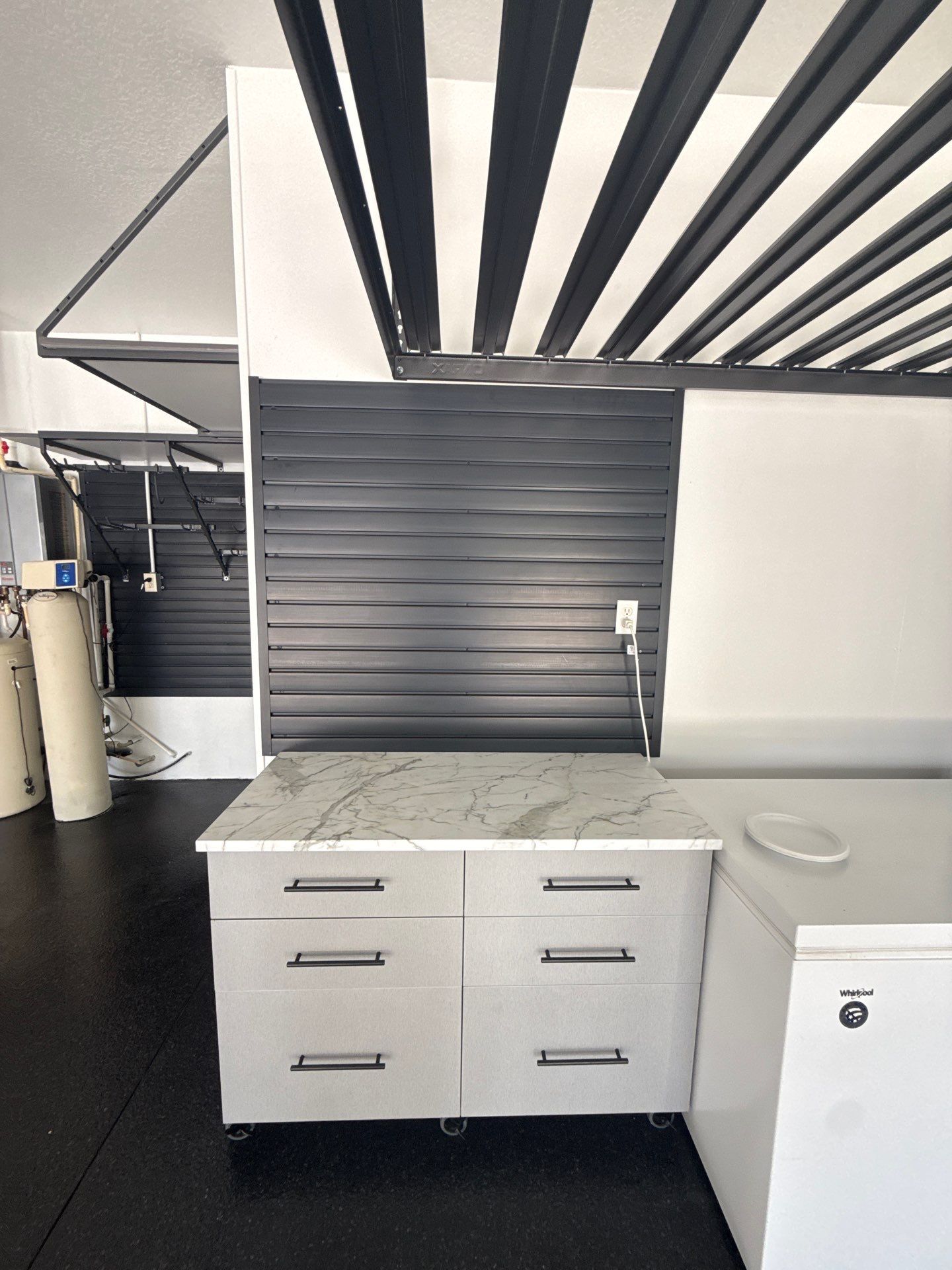 Tampa Garage Floor Coating and Overhead Storage Rack Installation by Square 1 Garage and Closet Solutions