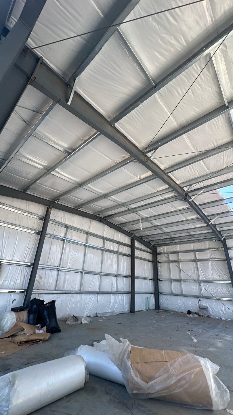 Dark Green Metal Siding by Reimagine Roofing