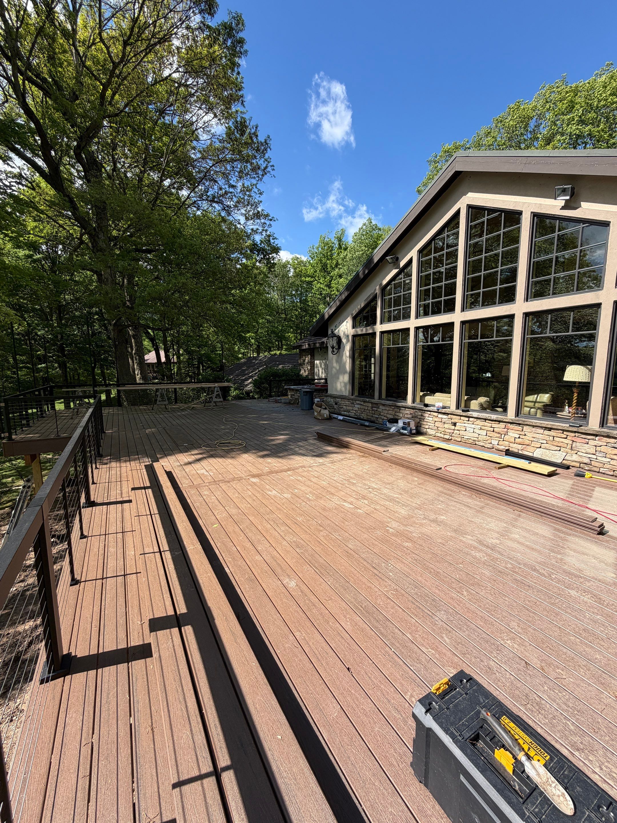 1500 sq/ft Composite Deck Build with Outdoor Kitchen in Champion by Cousins Roofing Siding & Decks