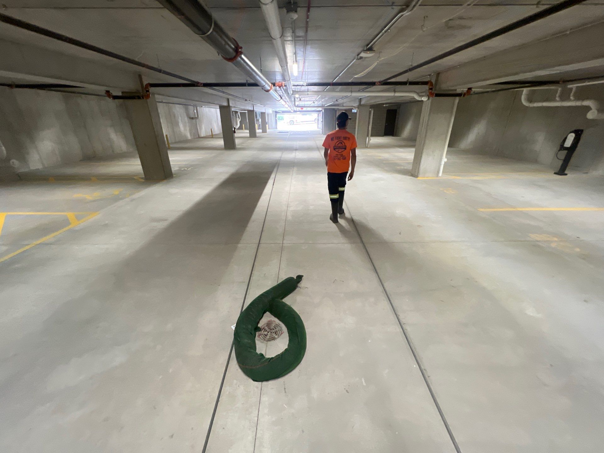 Parking garage using Hot water by Northern Power Washing LLC.