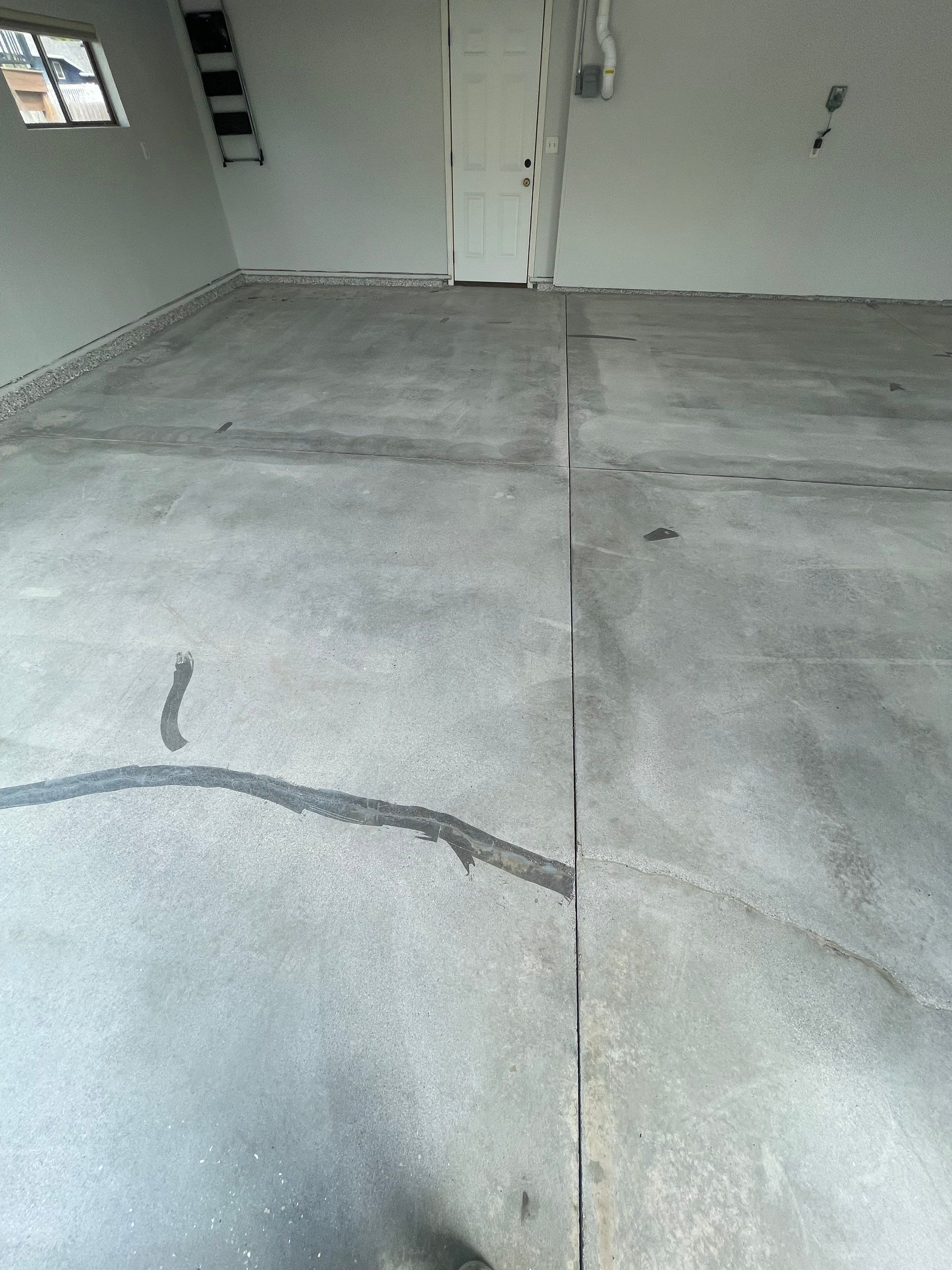 Multi-Car Garage Floor Coating and Crack Repair in Tea by Select Painting, Coatings & Garage Cabinets