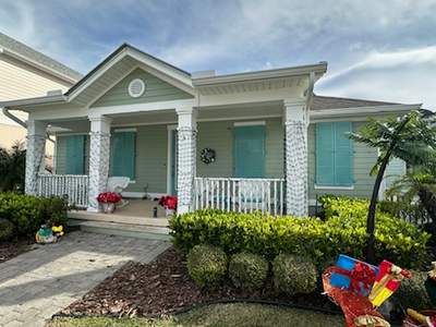 Hurricane Rated Colonial Shutters in Pastel Turquoise