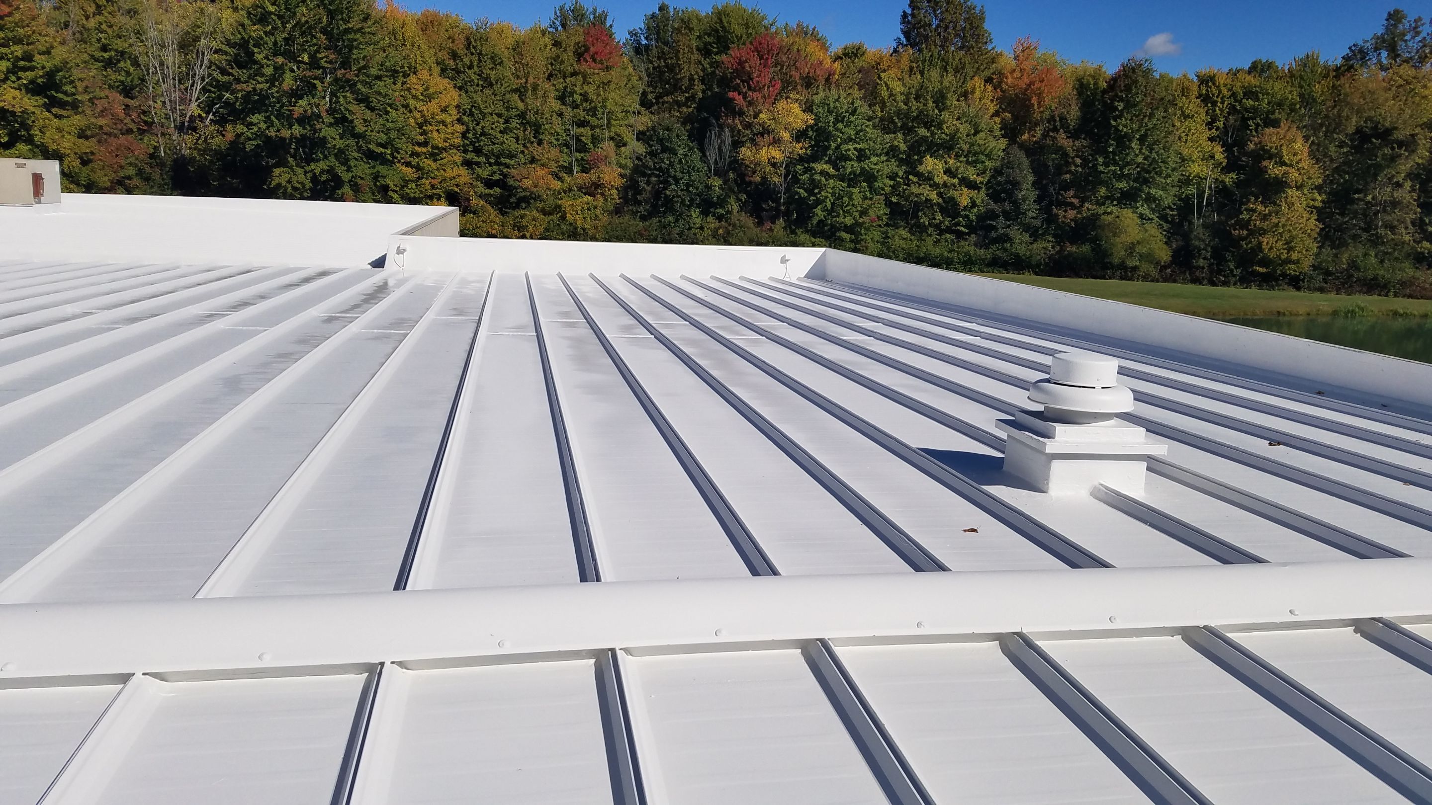 Commercial Metal Roof Coating by Gold Star Roofing LLC