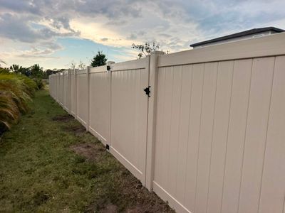 Tan Vinyl Privacy Fence Installation for Sarasota Home
