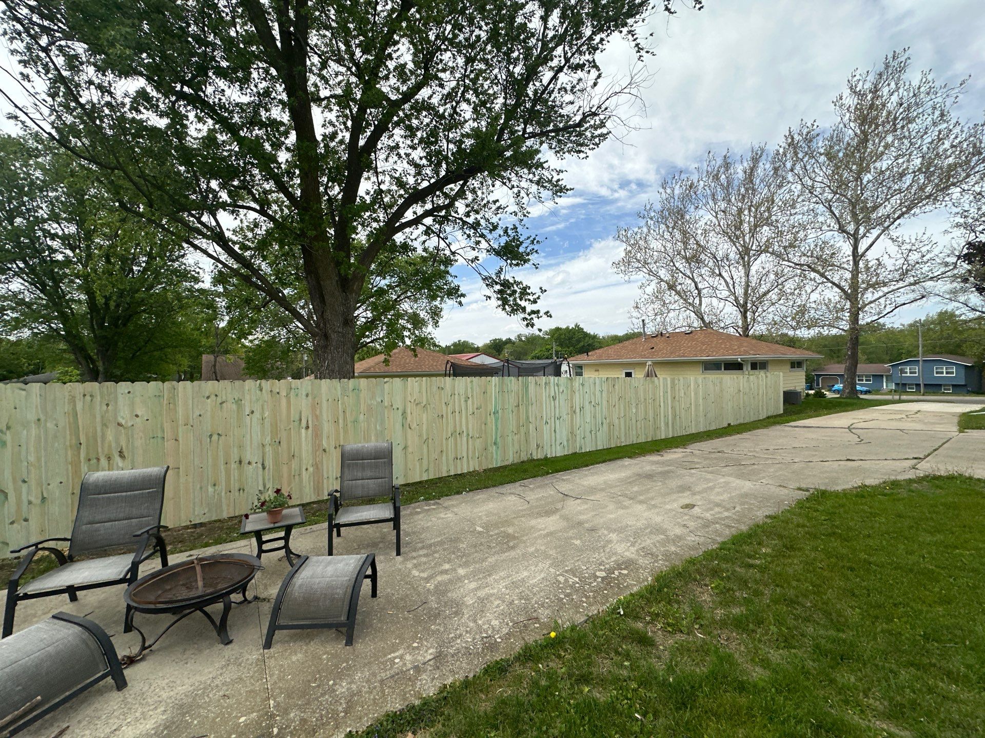 Pressure-Treated Wood Privacy Fence Installation in Waterloo by Perfect Picket Fence and Stain