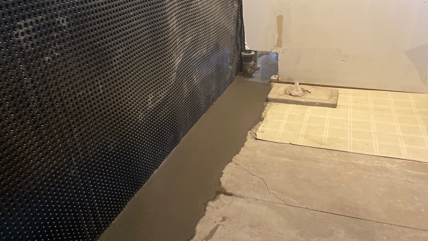 Interior Drain Tile & Buried Discharge in South Minneapolis by Waterproofing Northeast