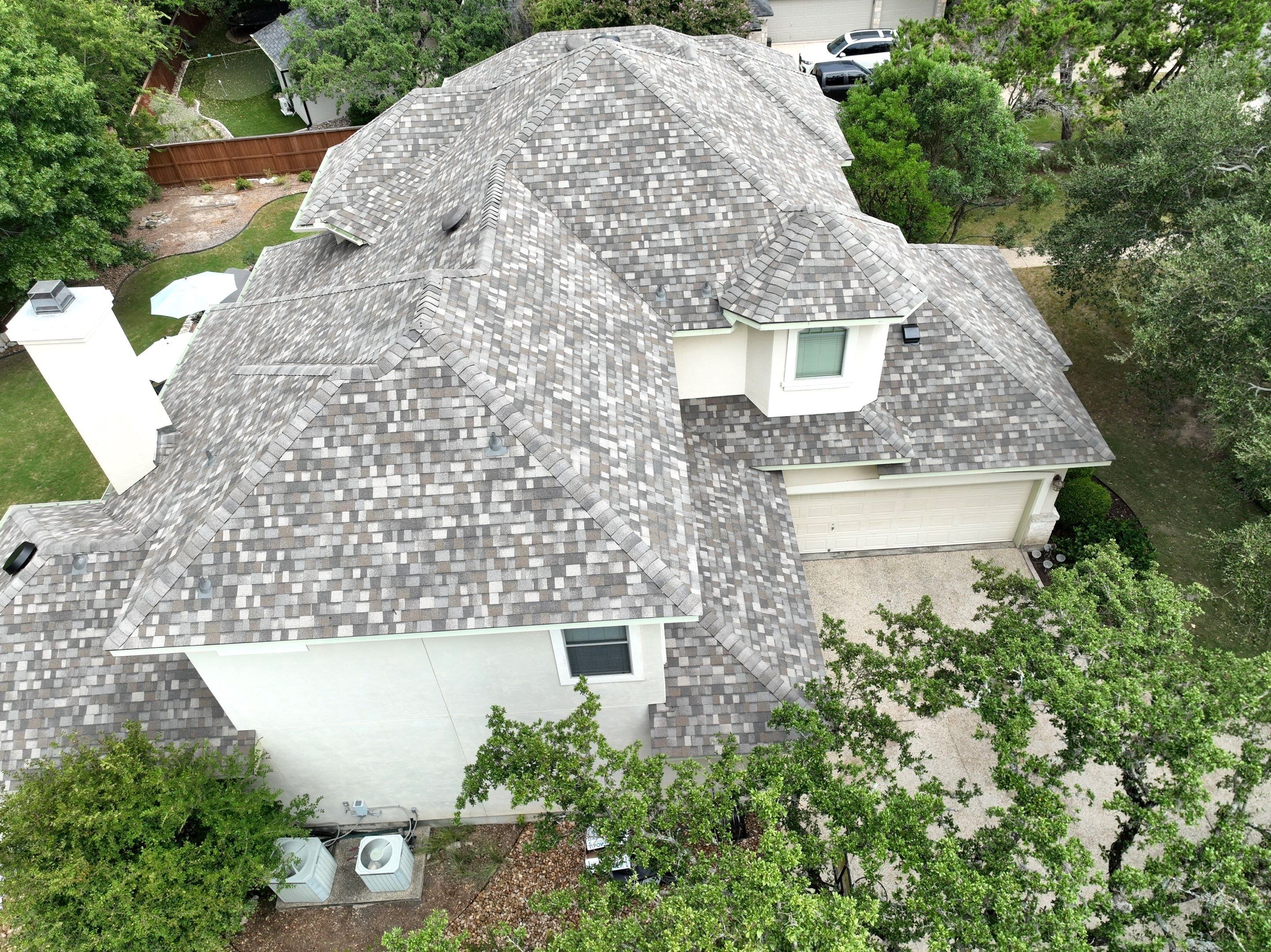 Residential Roof Replacement using 30 Year Laminate Shingles with High Profile Ridge by Premier Roofing and Contracting