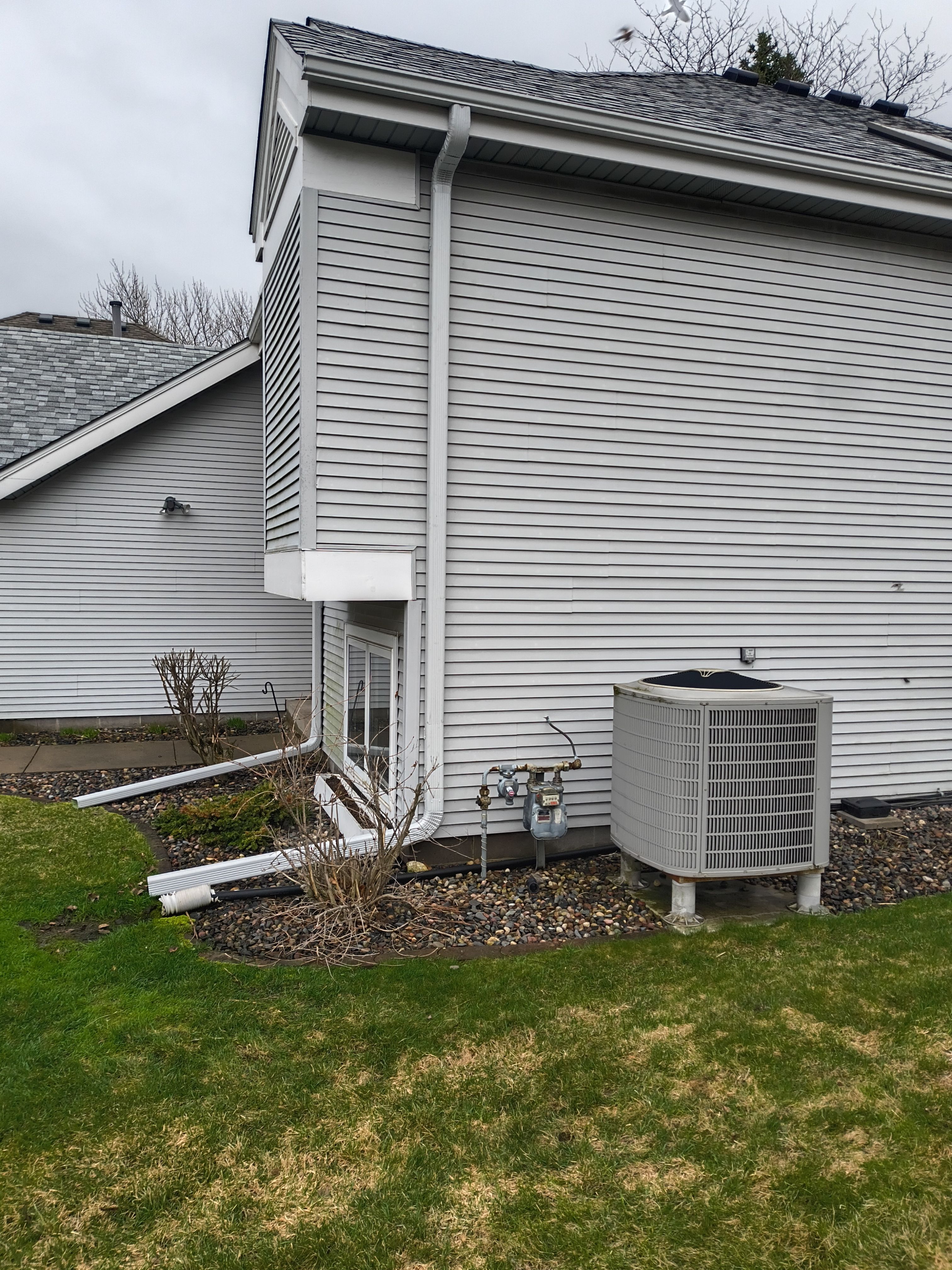 Seamless Gutter Installation in Plymouth MN | White Gutters, Silver Gray Downspouts & Gutter Guards by Next Level Seamless Gutters / Exteriors Inc.
