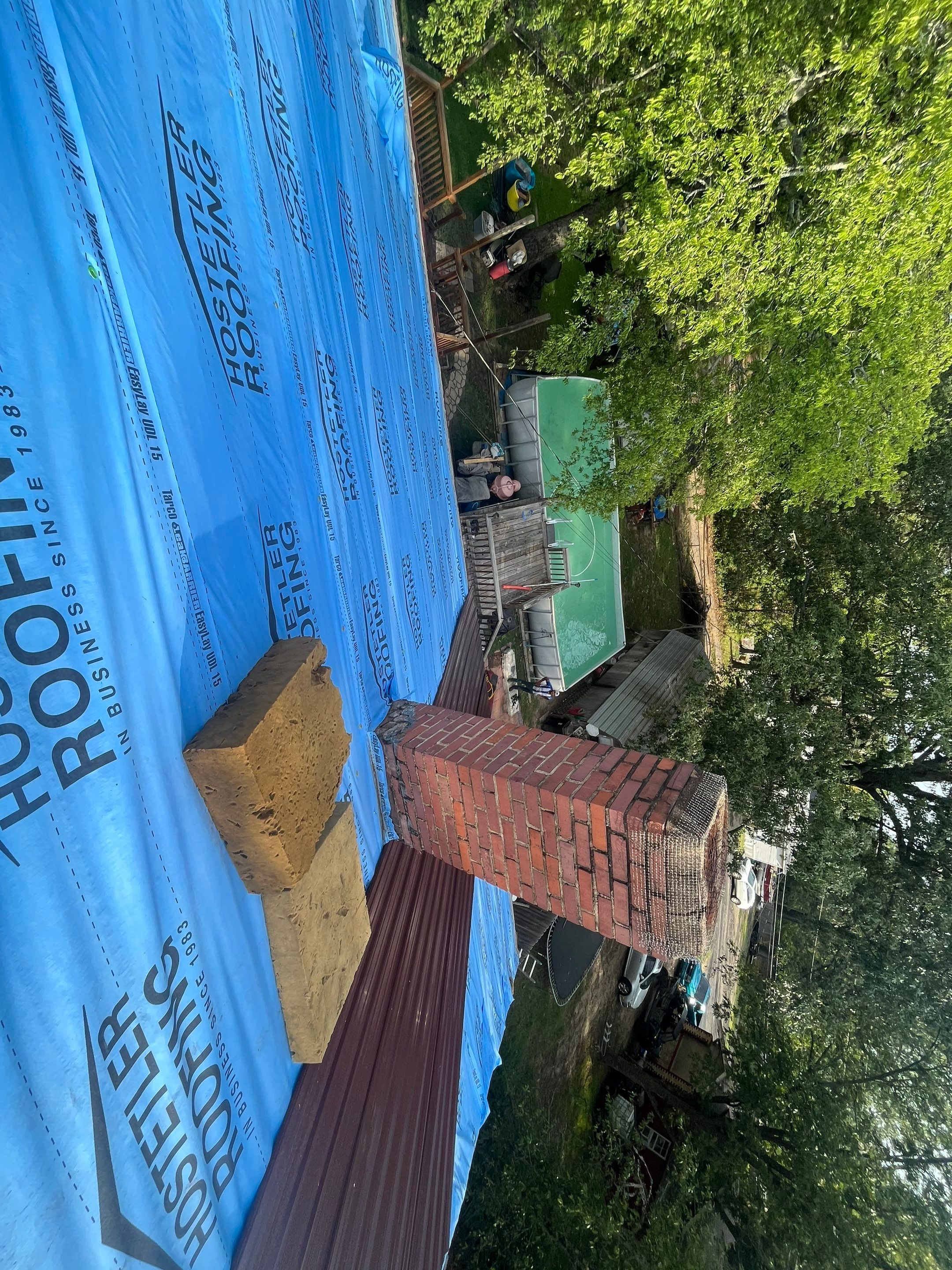 Residential Metal Roof Replacement using Reed's Metals: Colored Residental Panel (Burgundy) by Hostetler Roofing